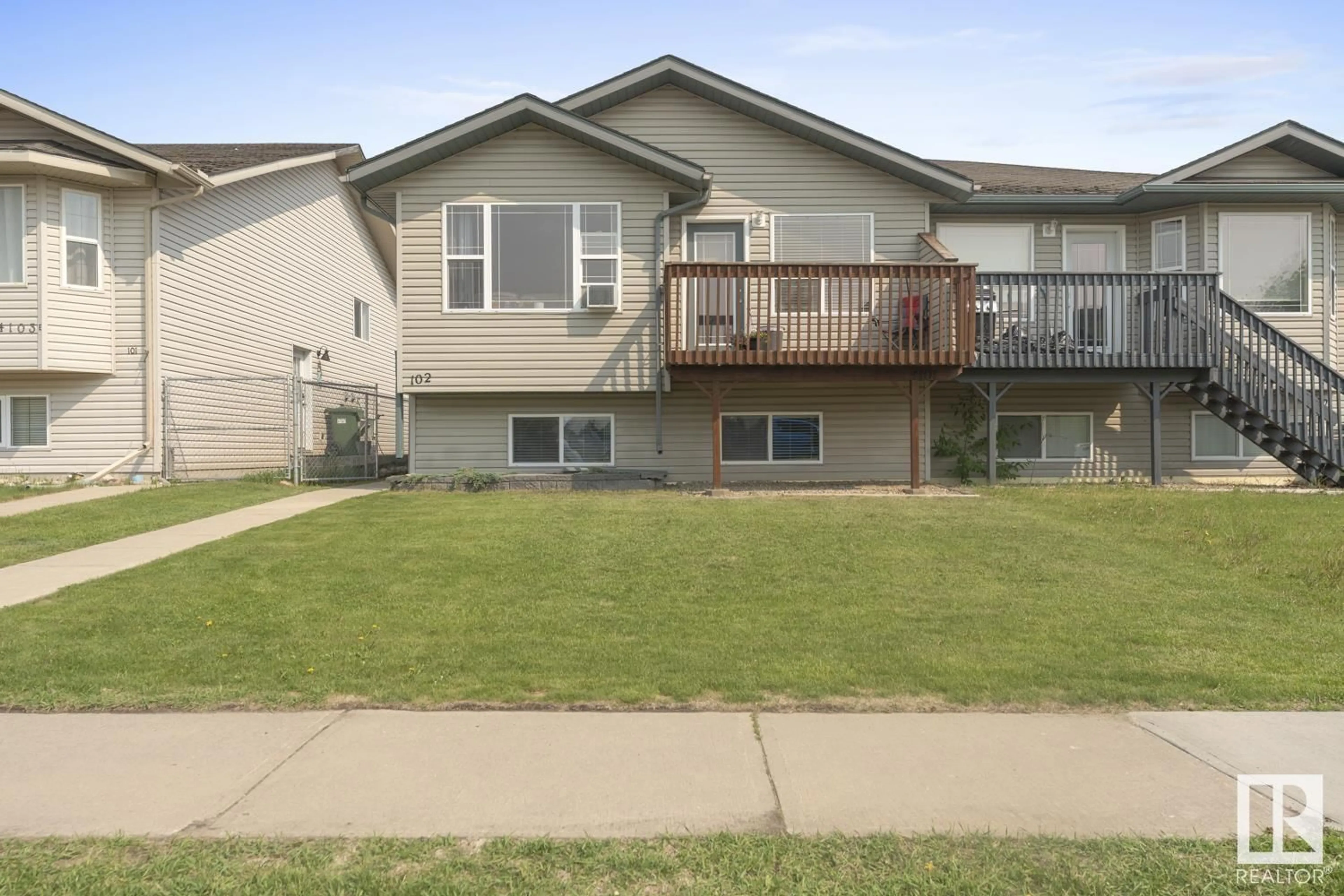 Home with vinyl exterior material, street for 102 - 4101 43 AV, Bonnyville Town Alberta T9N1W4