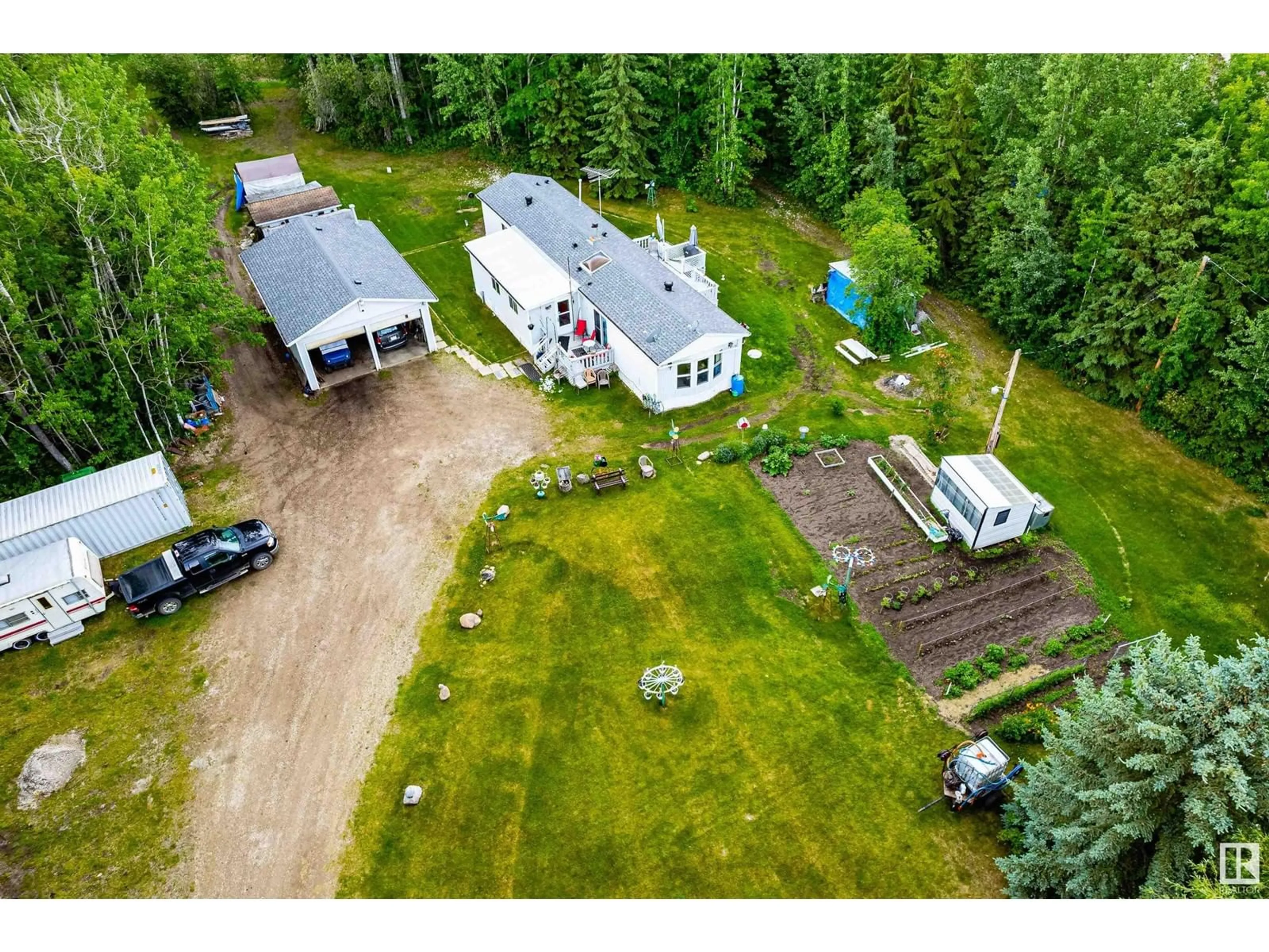 A pic from outside/outdoor area/front of a property/back of a property/a pic from drone, unknown for 54104 - 29 RGE ROAD 35, Rural Lac Ste. Anne County Alberta T0E0A1