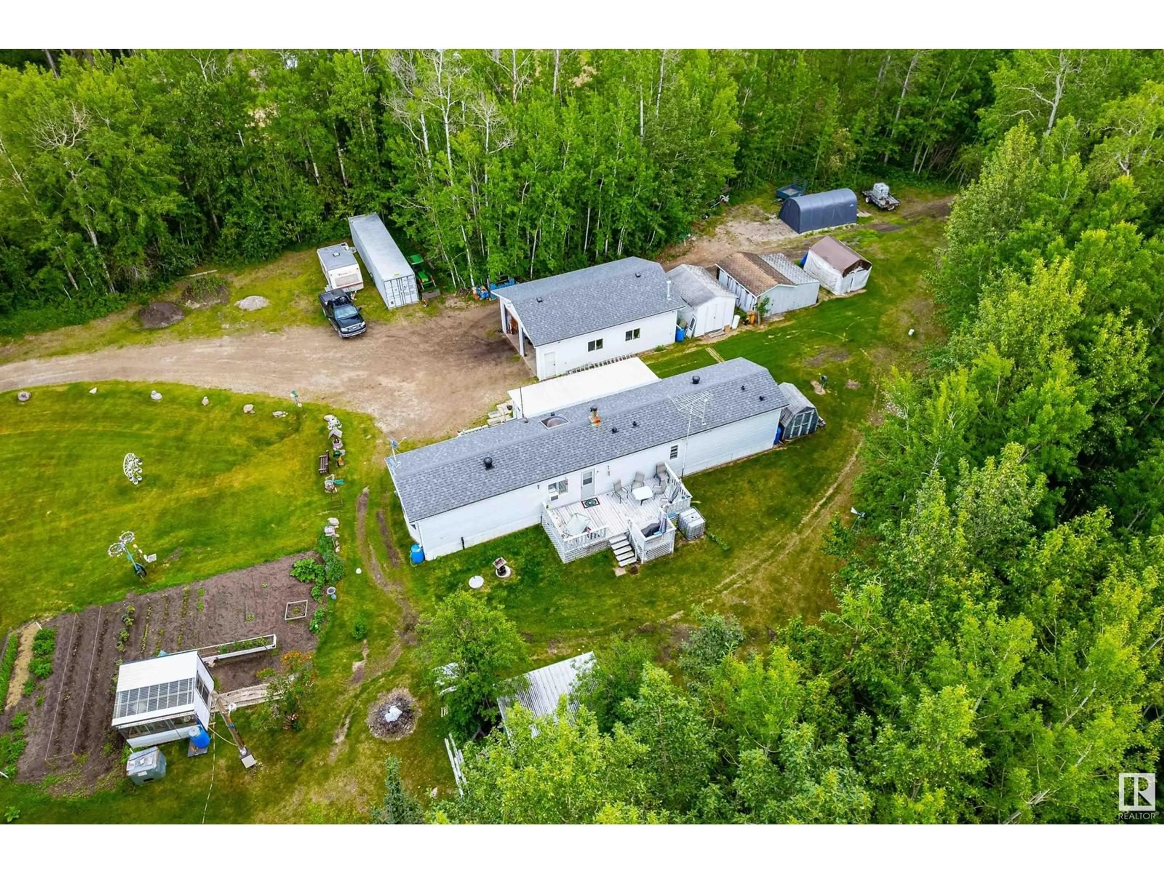 A pic from outside/outdoor area/front of a property/back of a property/a pic from drone, unknown for 54104 - 29 RGE ROAD 35, Rural Lac Ste. Anne County Alberta T0E0A1
