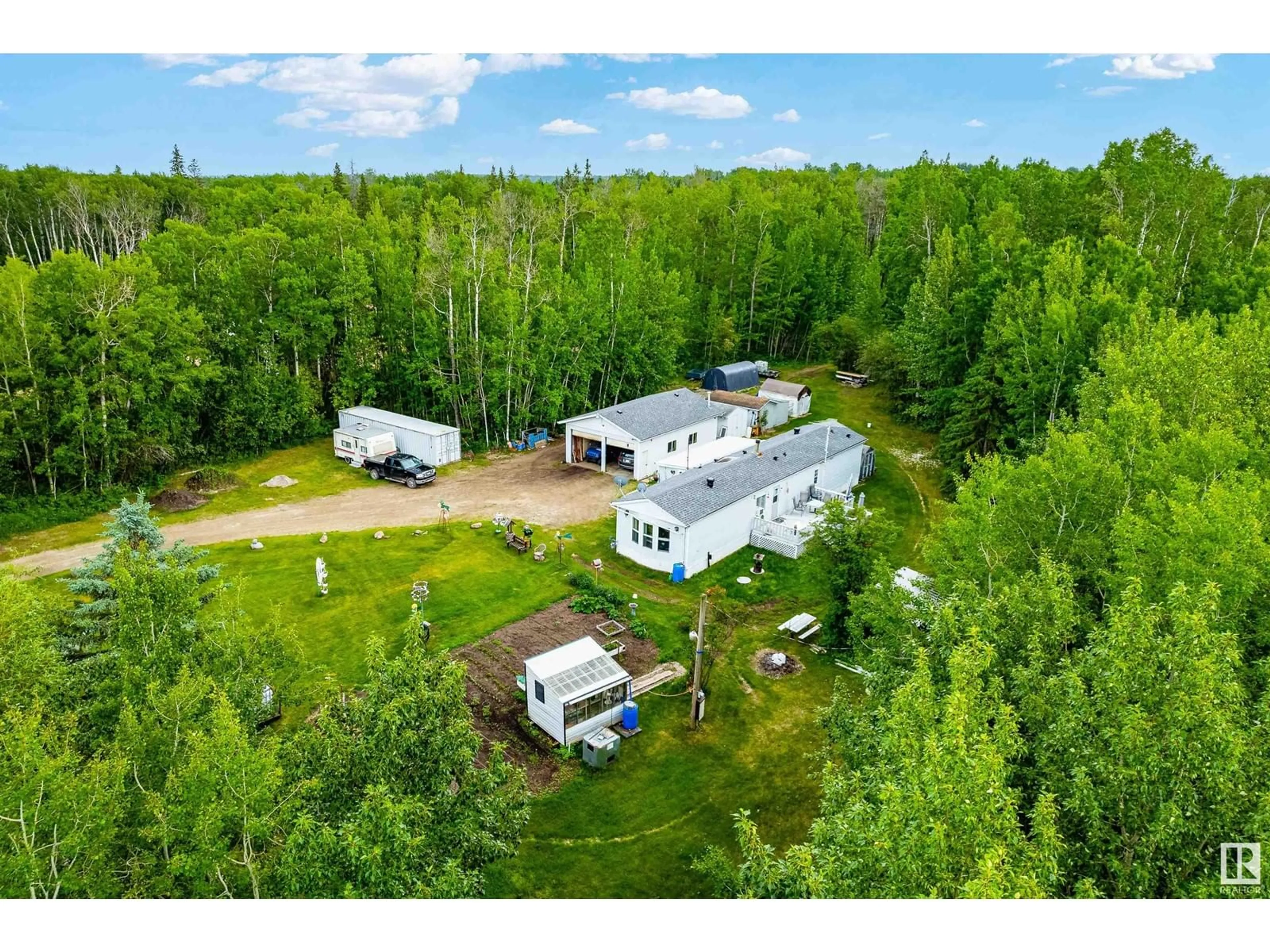 A pic from outside/outdoor area/front of a property/back of a property/a pic from drone, unknown for 54104 - 29 RGE ROAD 35, Rural Lac Ste. Anne County Alberta T0E0A1