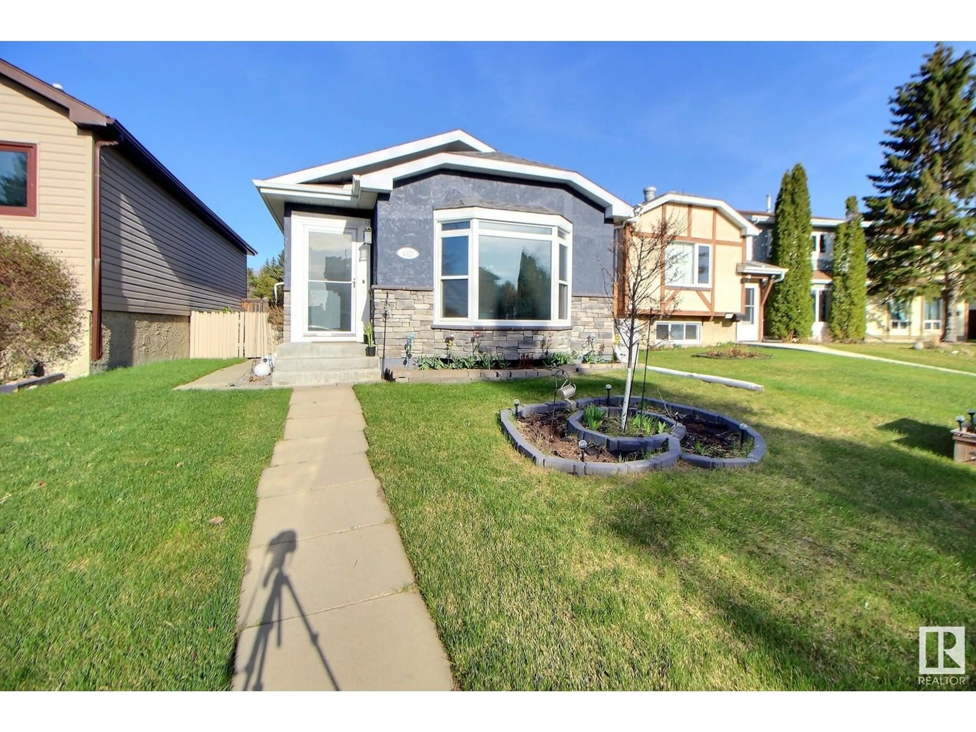 Home with vinyl exterior material, street for 4315 35 ST, Edmonton Alberta T6L5J6