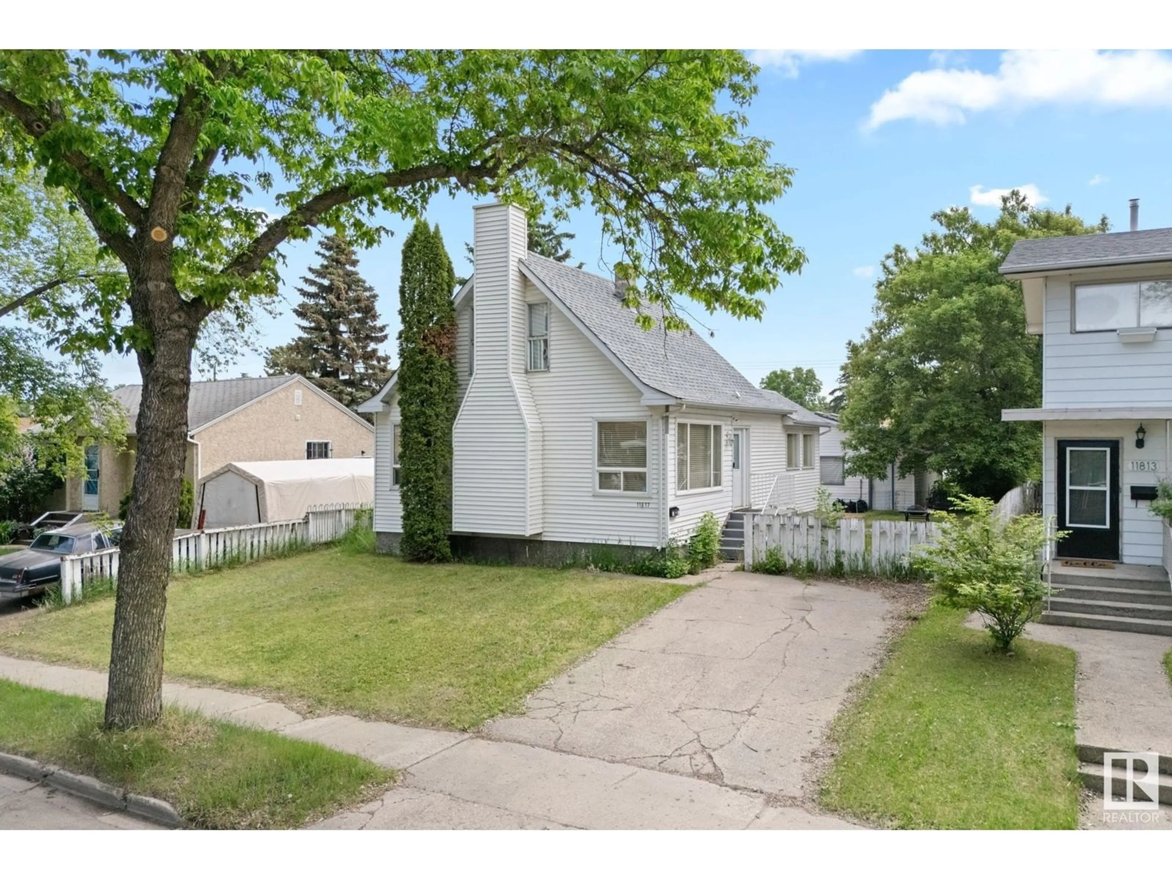 Home with vinyl exterior material, street for 11817 44 ST, Edmonton Alberta T5W2S4