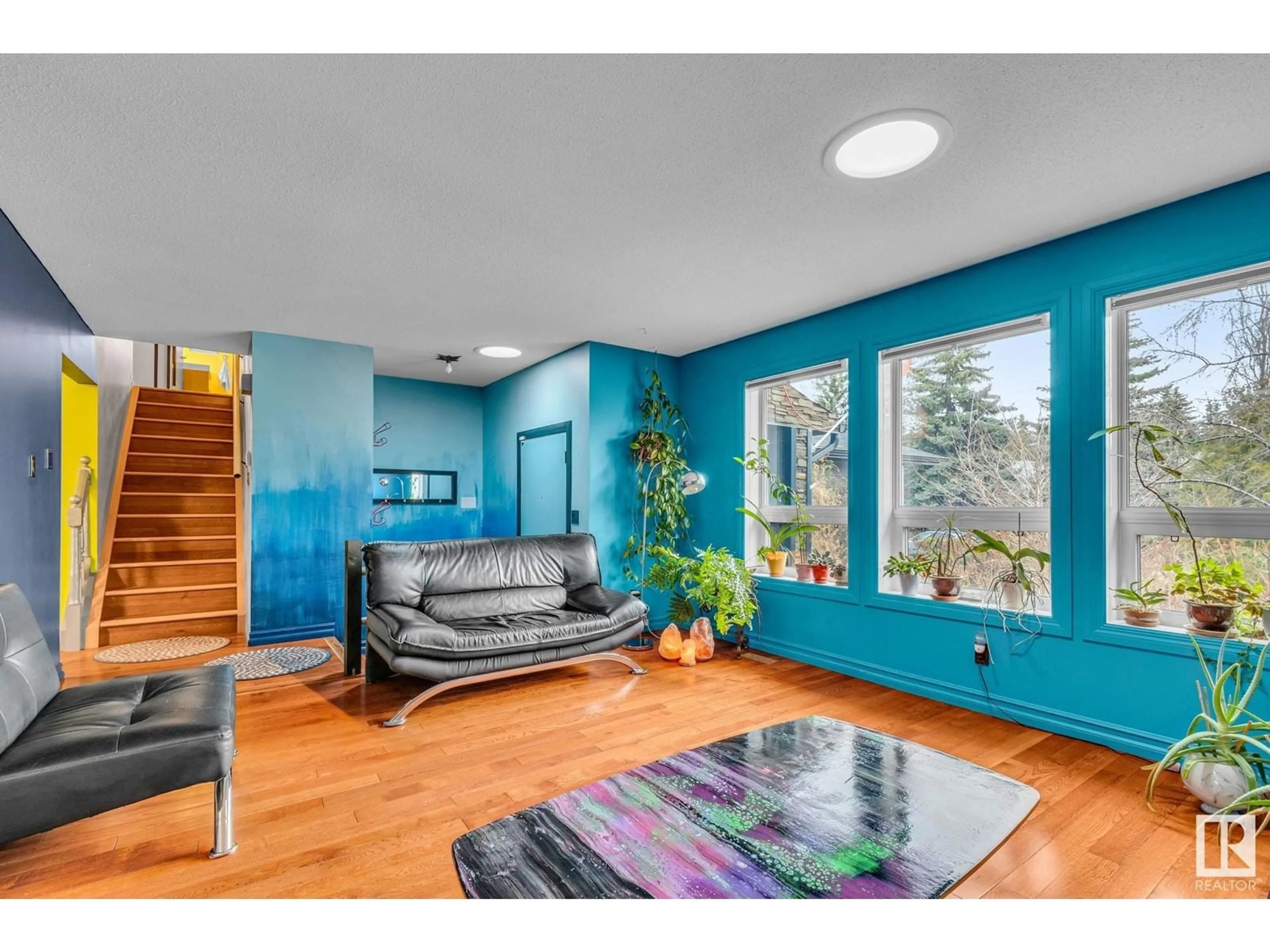 Living room with furniture, wood/laminate floor for NW - 3018 110A ST, Edmonton Alberta T6J3G1