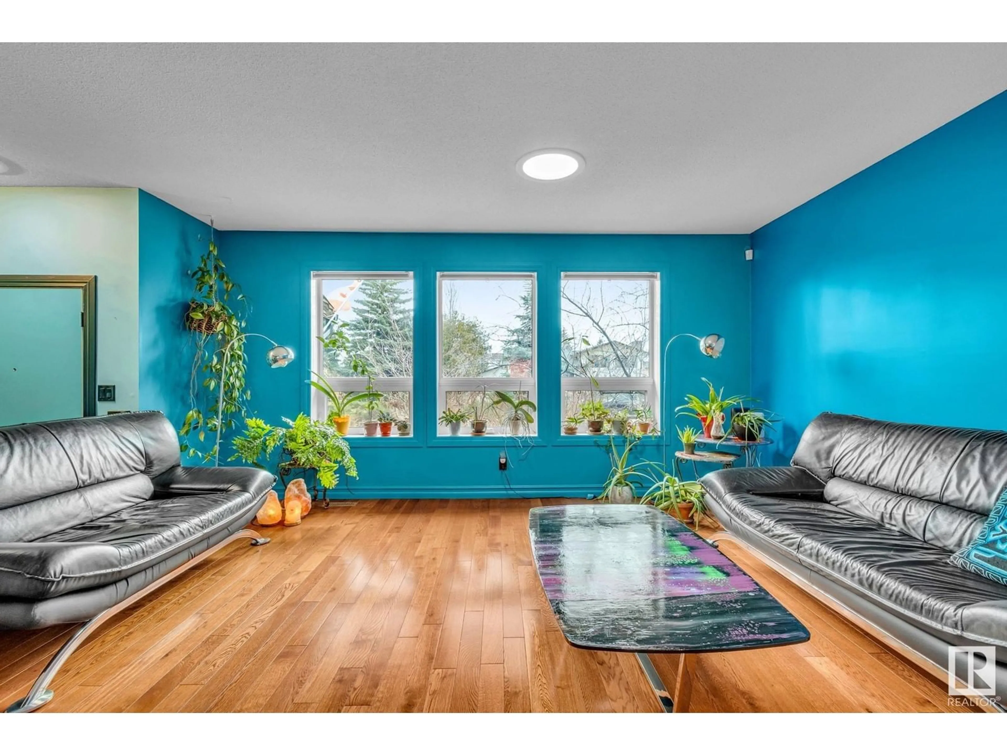 Living room with furniture, wood/laminate floor for NW - 3018 110A ST, Edmonton Alberta T6J3G1