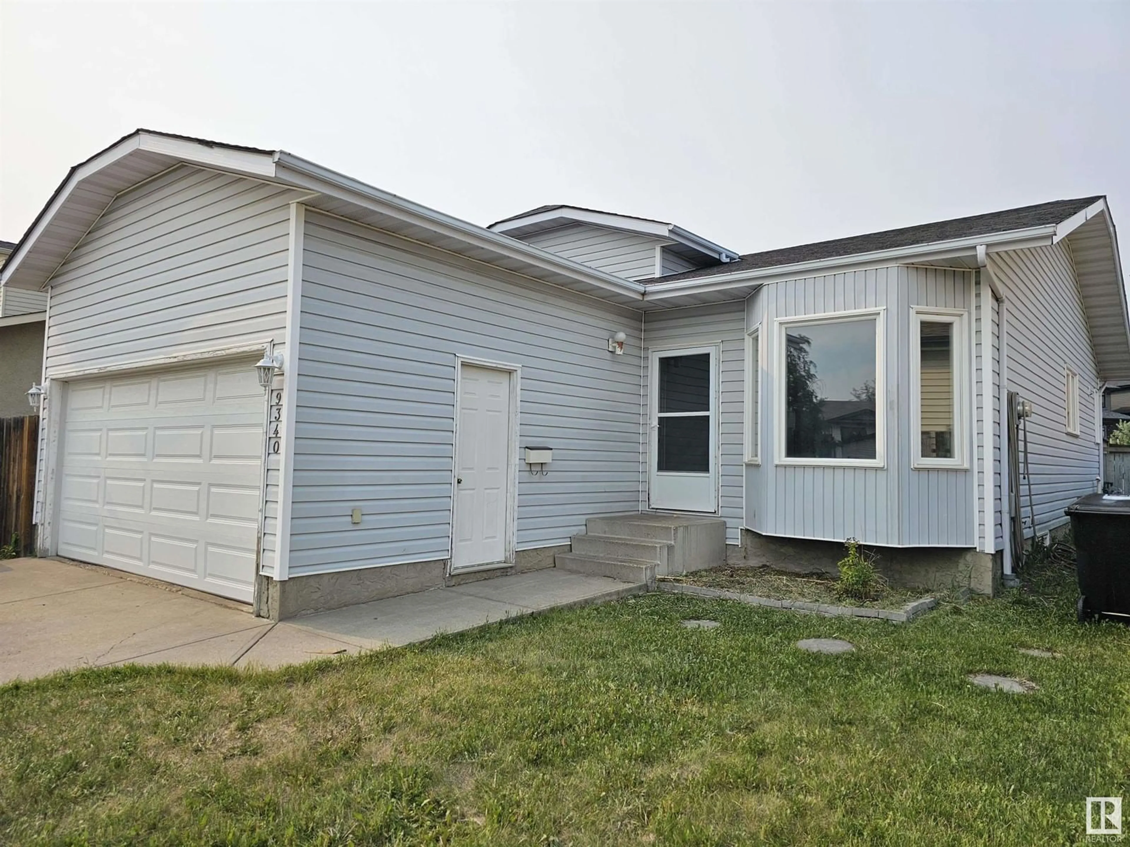 Home with vinyl exterior material, street for NW - 9340 180A AV, Edmonton Alberta T5Z2J3