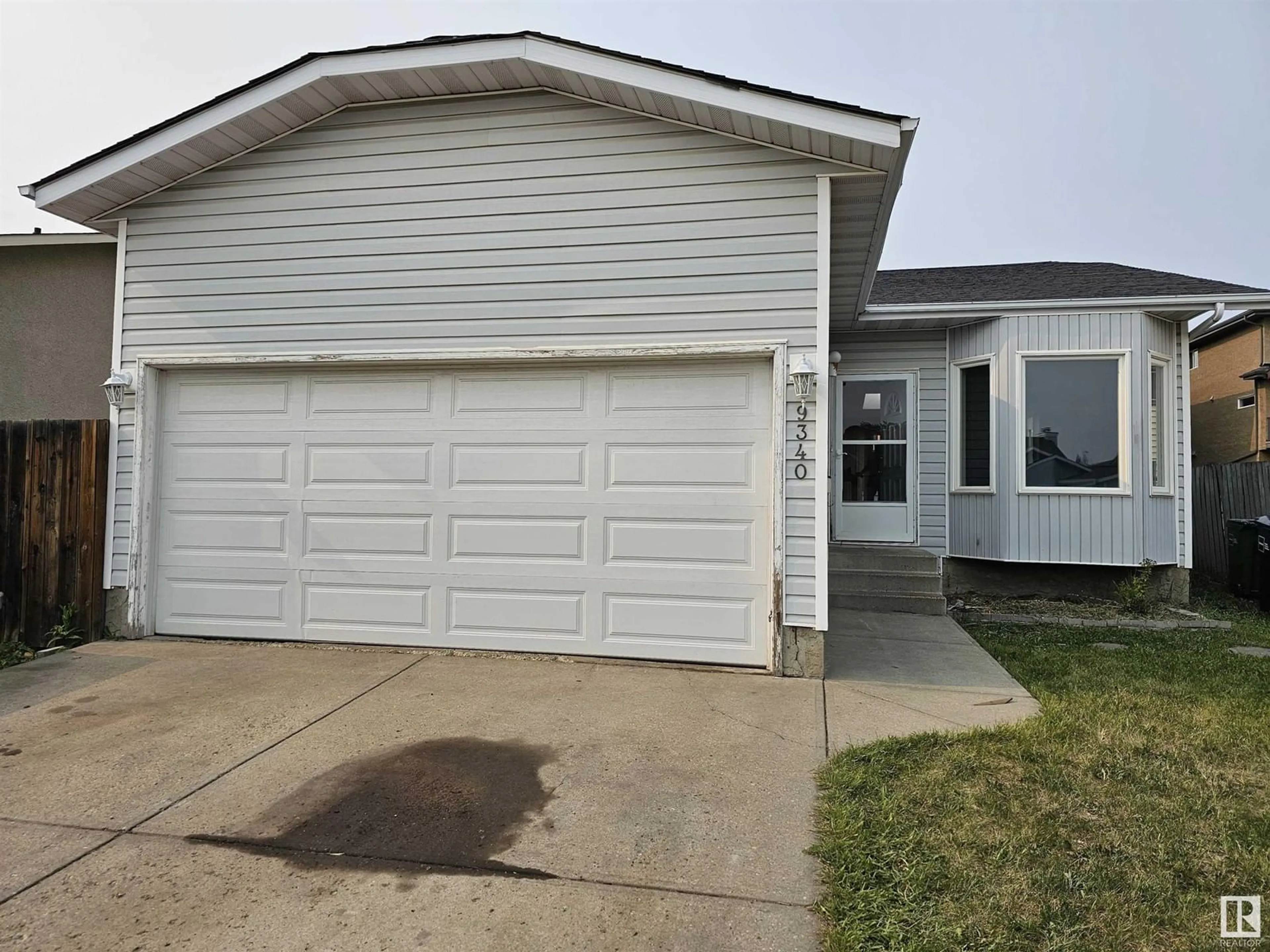 Home with vinyl exterior material, street for NW - 9340 180A AV, Edmonton Alberta T5Z2J3