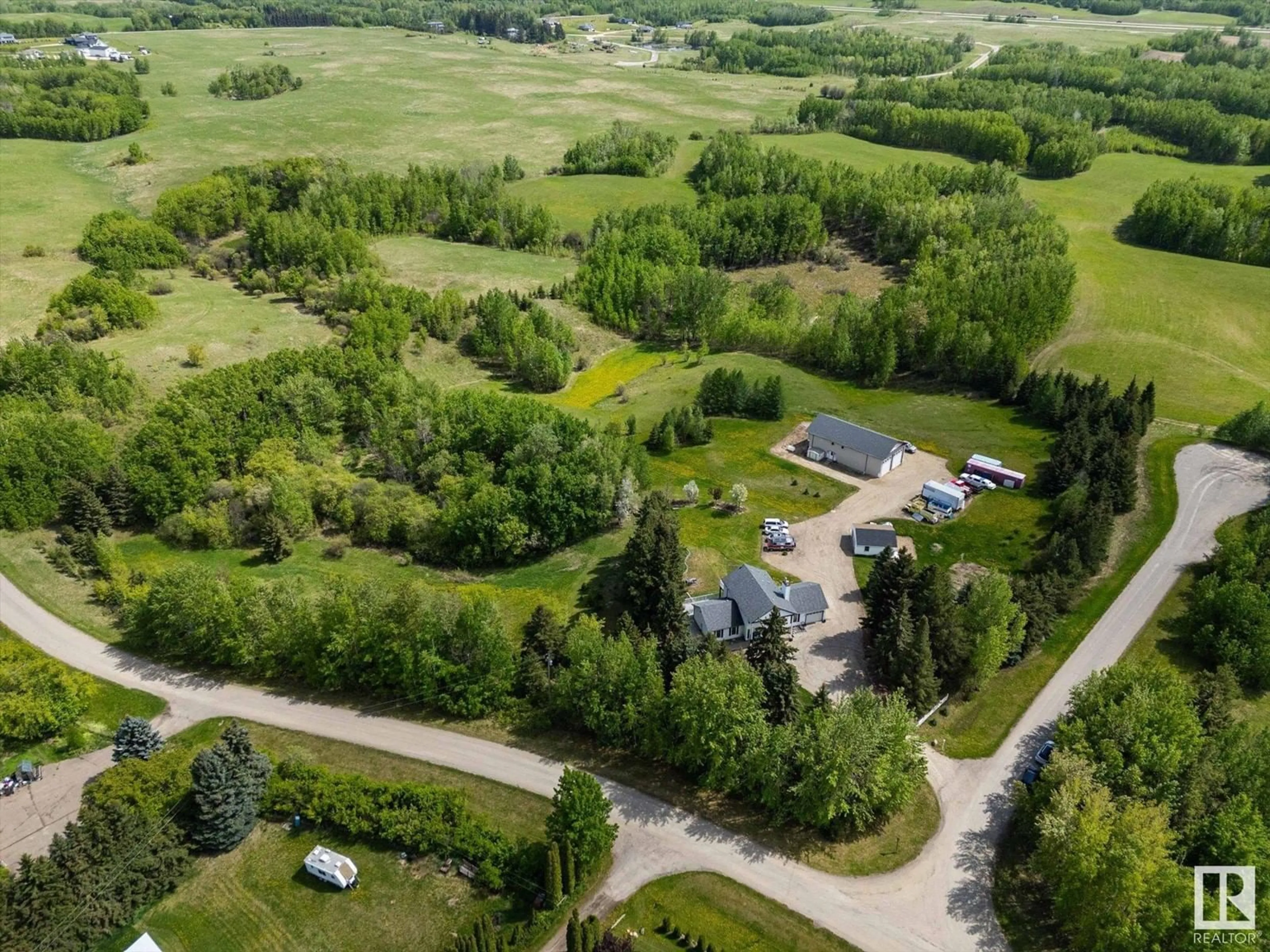A pic from outside/outdoor area/front of a property/back of a property/a pic from drone, unknown for #11 - 53227 RGE ROAD 14, Rural Parkland County Alberta T7Y0G3