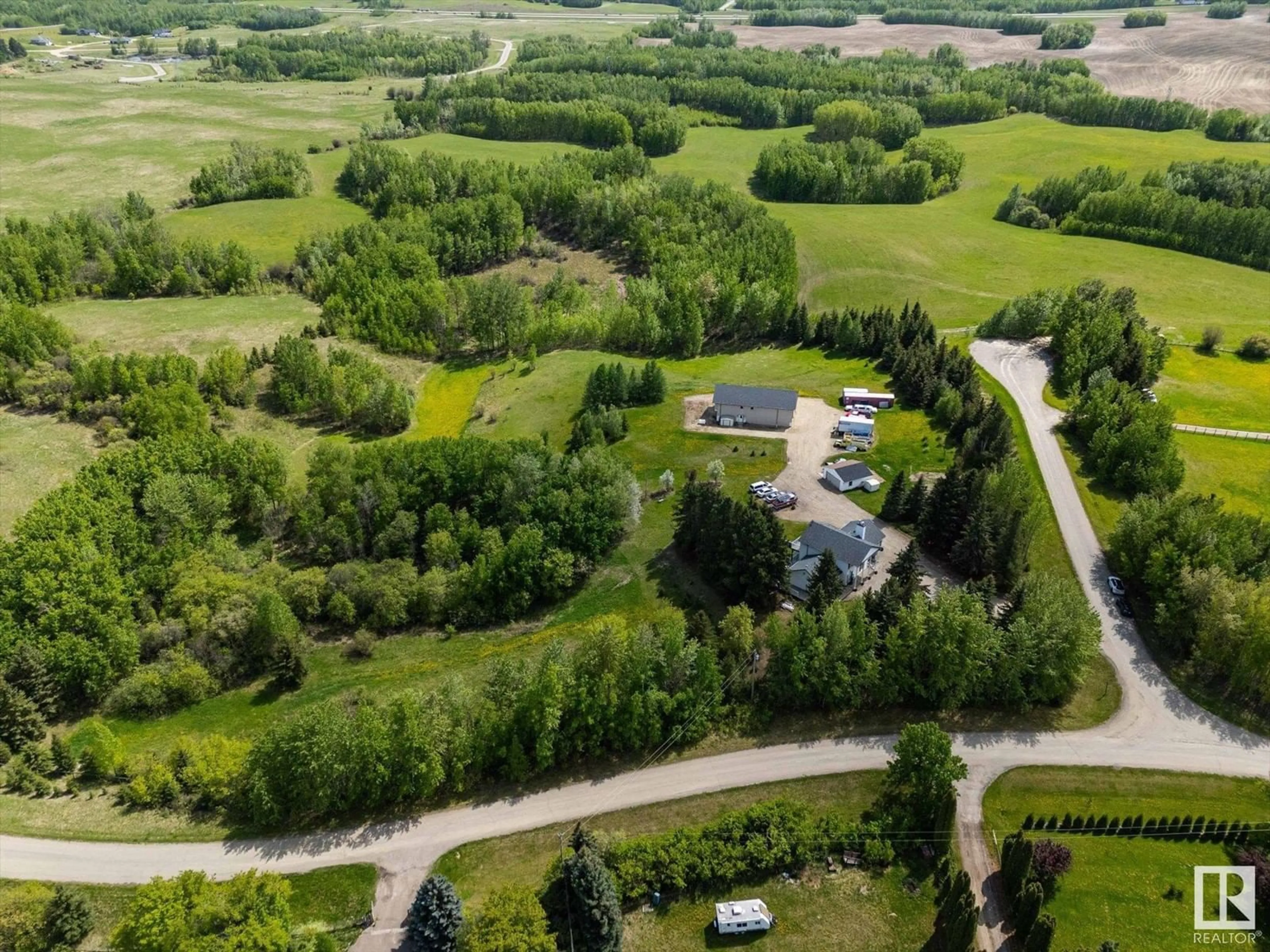 A pic from outside/outdoor area/front of a property/back of a property/a pic from drone, unknown for #11 - 53227 RGE ROAD 14, Rural Parkland County Alberta T7Y0G3