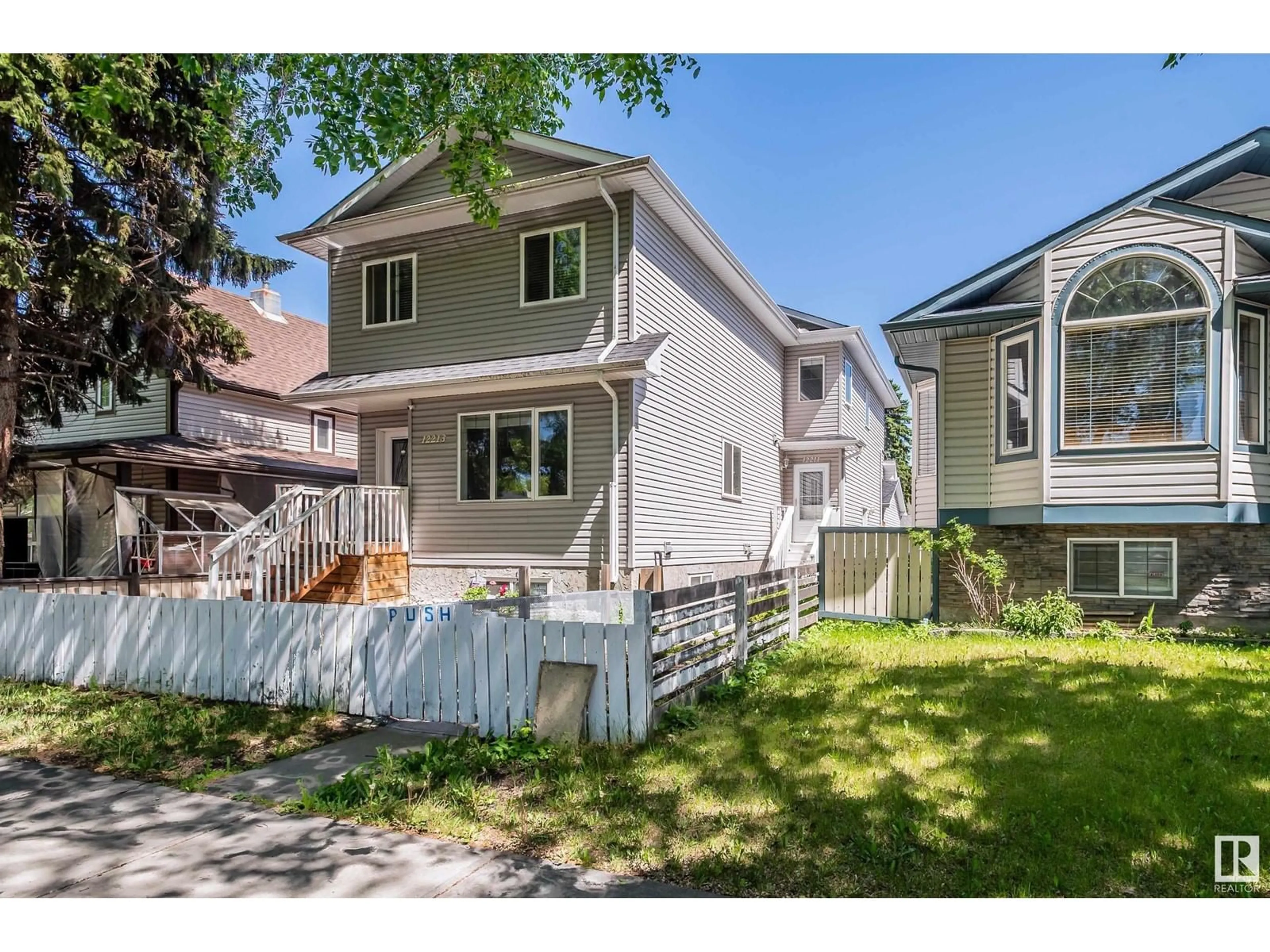 Home with vinyl exterior material, street for 12211 91 ST, Edmonton Alberta T5B4C4