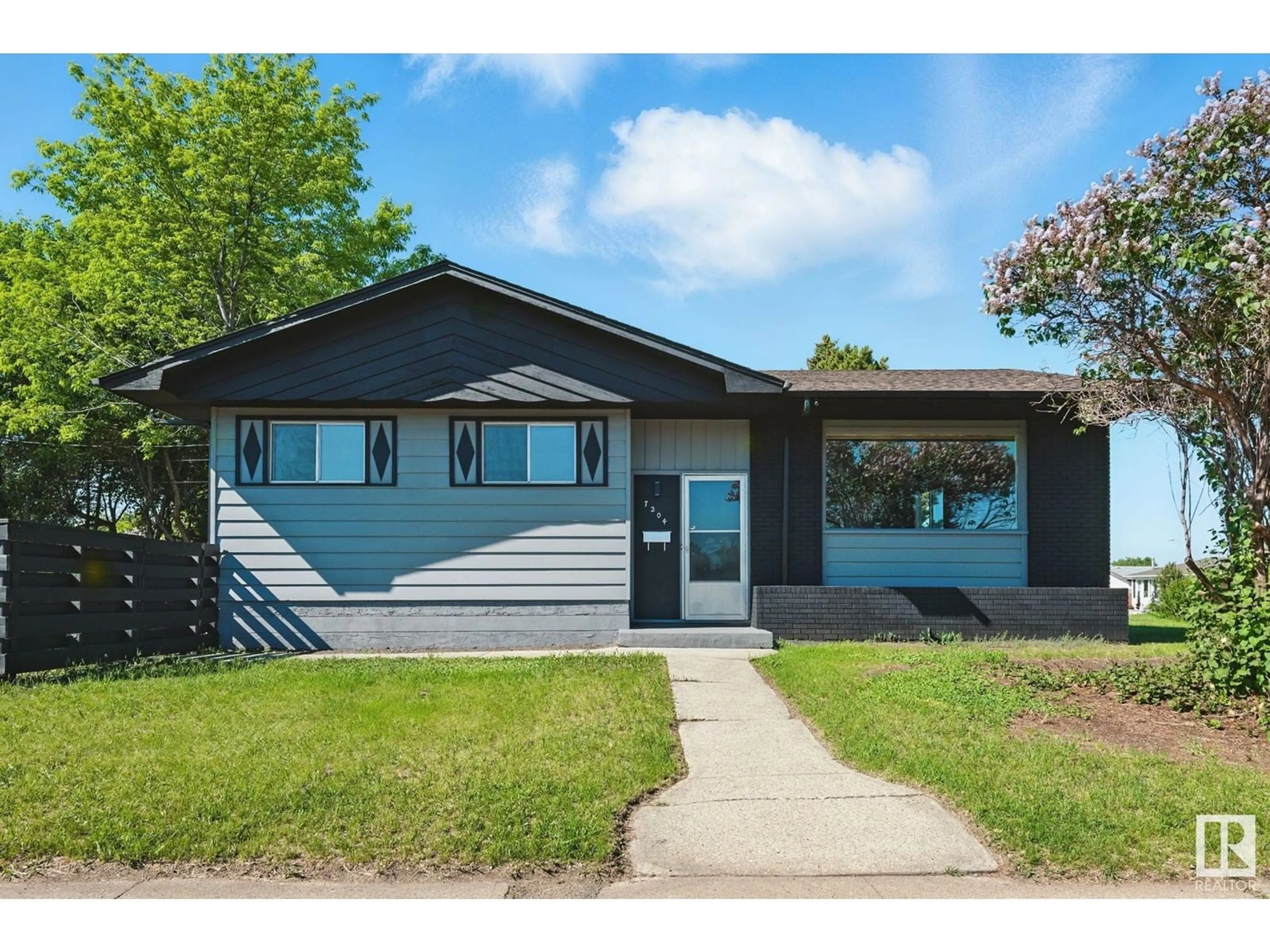 Home with vinyl exterior material, street for 7204 130 AV, Edmonton Alberta T5C1X9