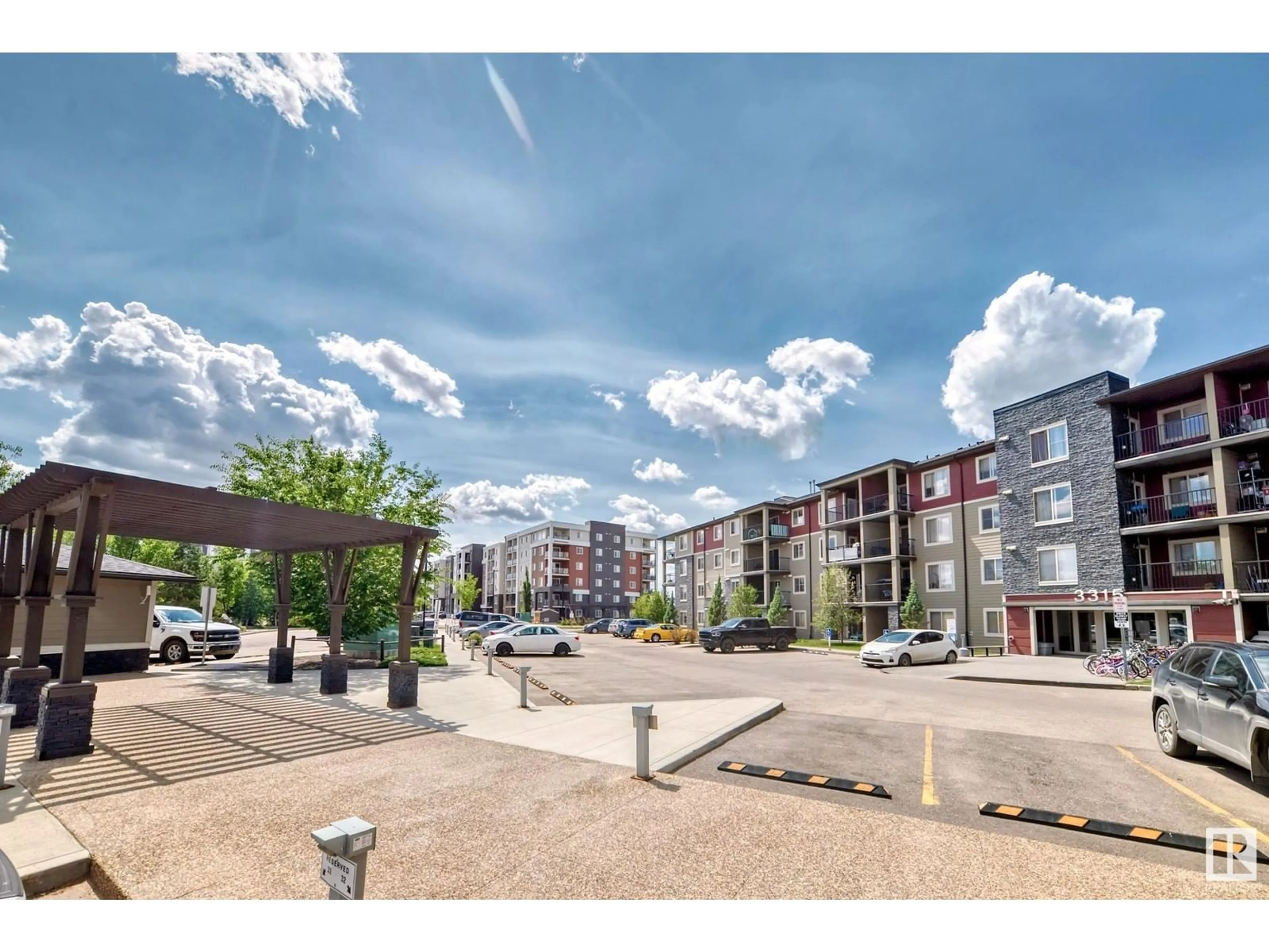 A pic from outside/outdoor area/front of a property/back of a property/a pic from drone, street for #427 - 3315 JAMES MOWATT TR, Edmonton Alberta T6W3L9
