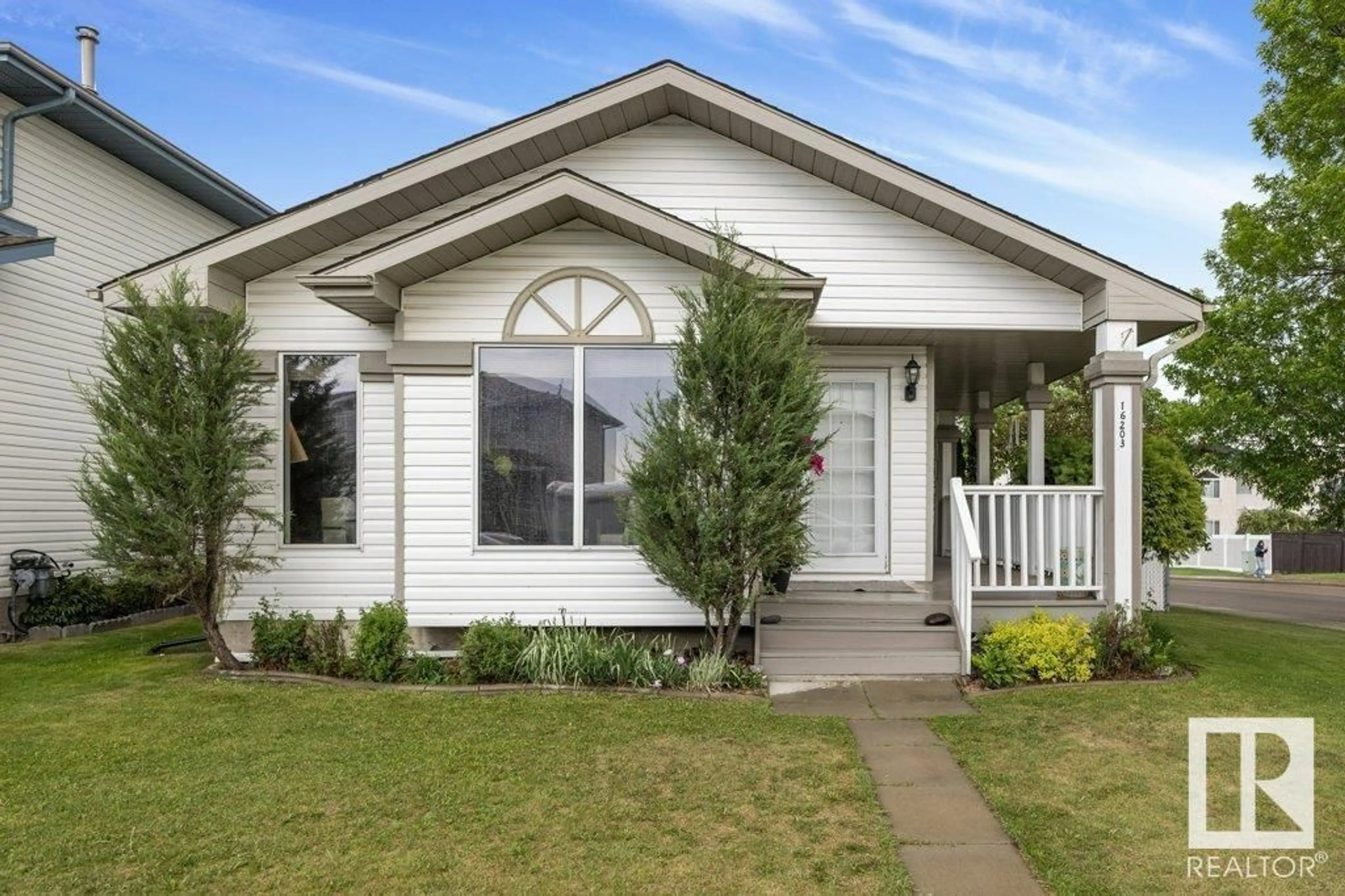 Home with vinyl exterior material, street for 16203 57 ST, Edmonton Alberta T5Y2V3