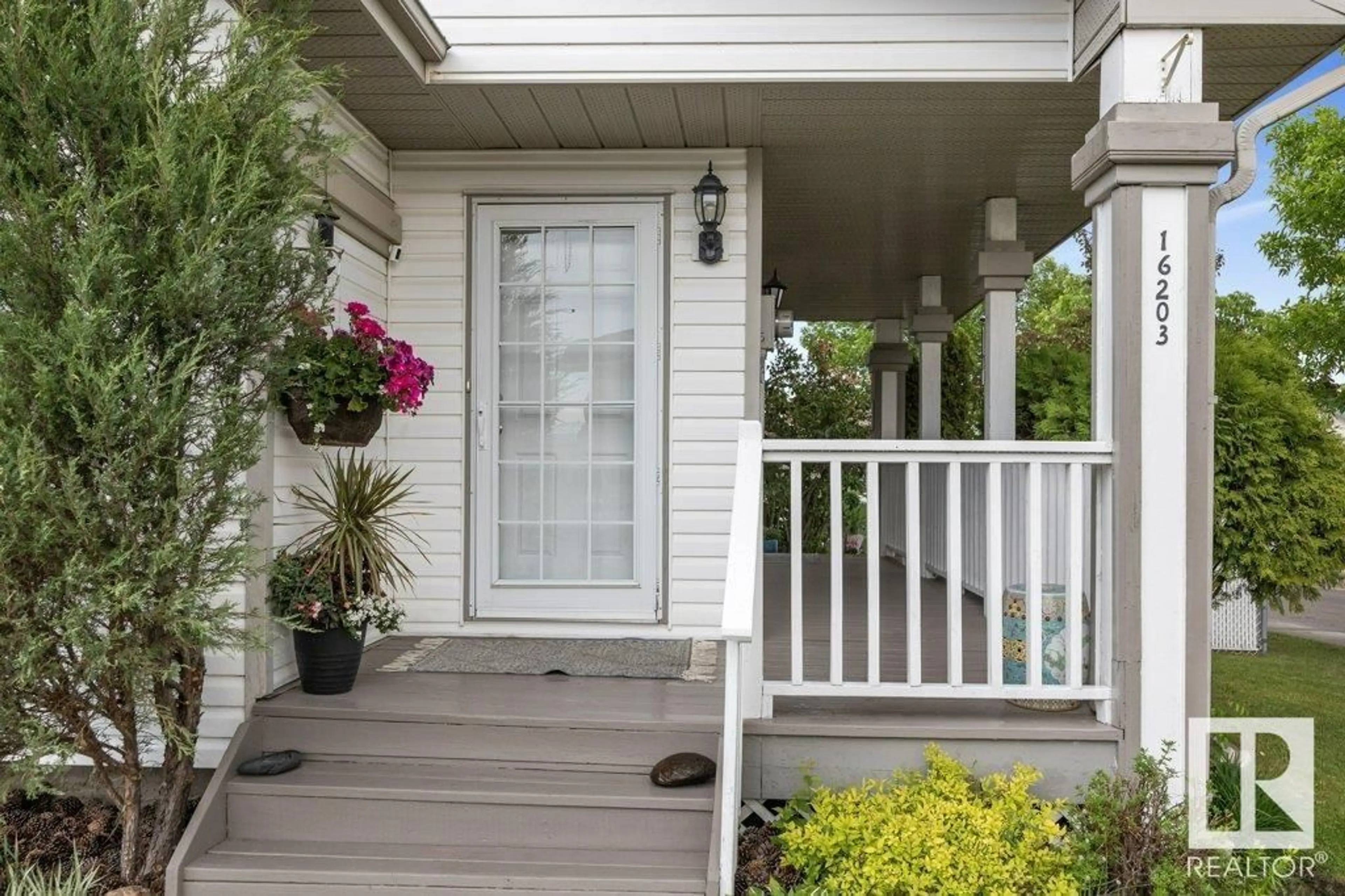 Home with vinyl exterior material, street for 16203 57 ST, Edmonton Alberta T5Y2V3