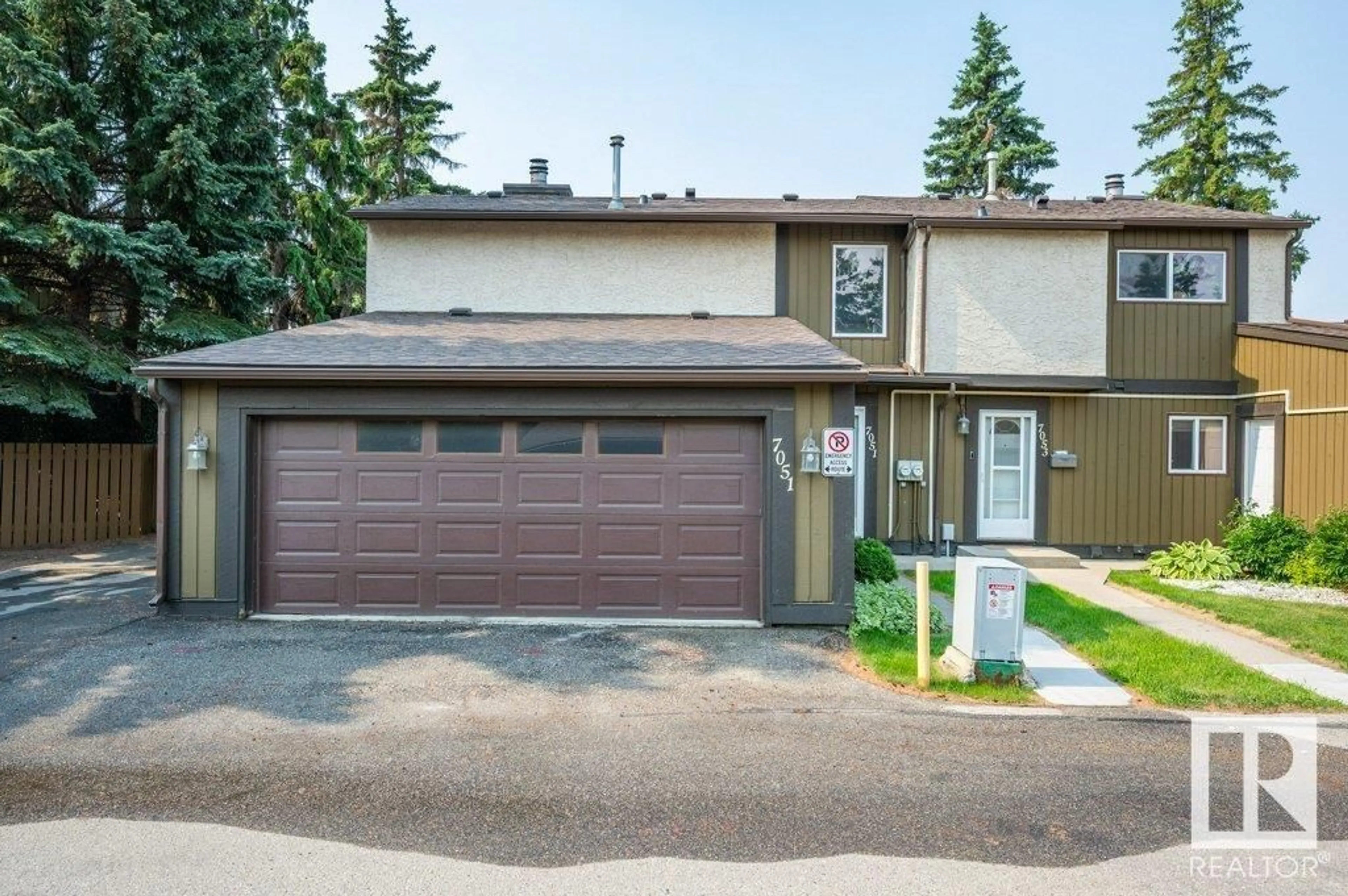 Home with vinyl exterior material, street for 7051 32 AV, Edmonton Alberta T6K2K9