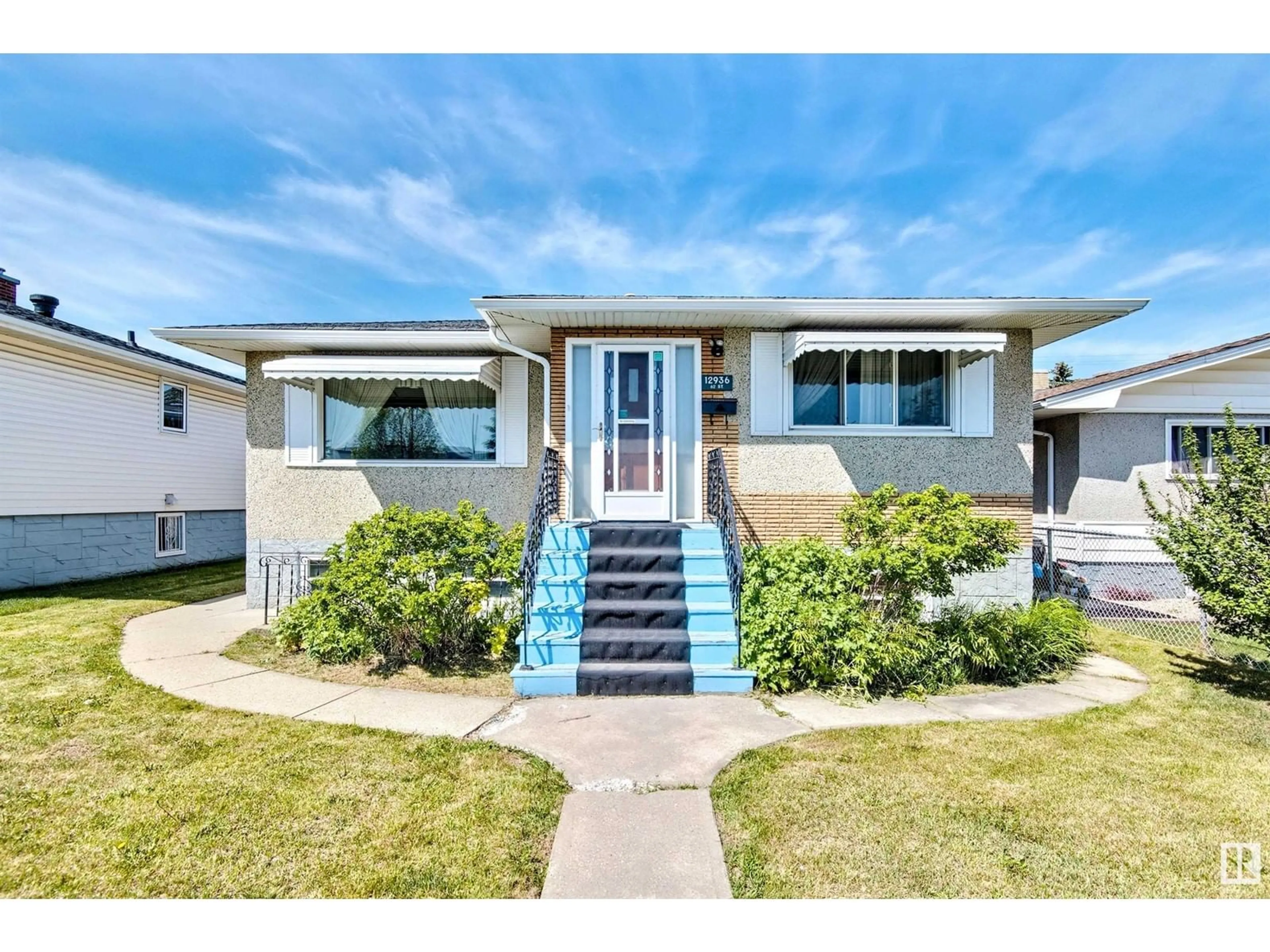Home with vinyl exterior material, street for 12936 62 ST, Edmonton Alberta T5A0T9