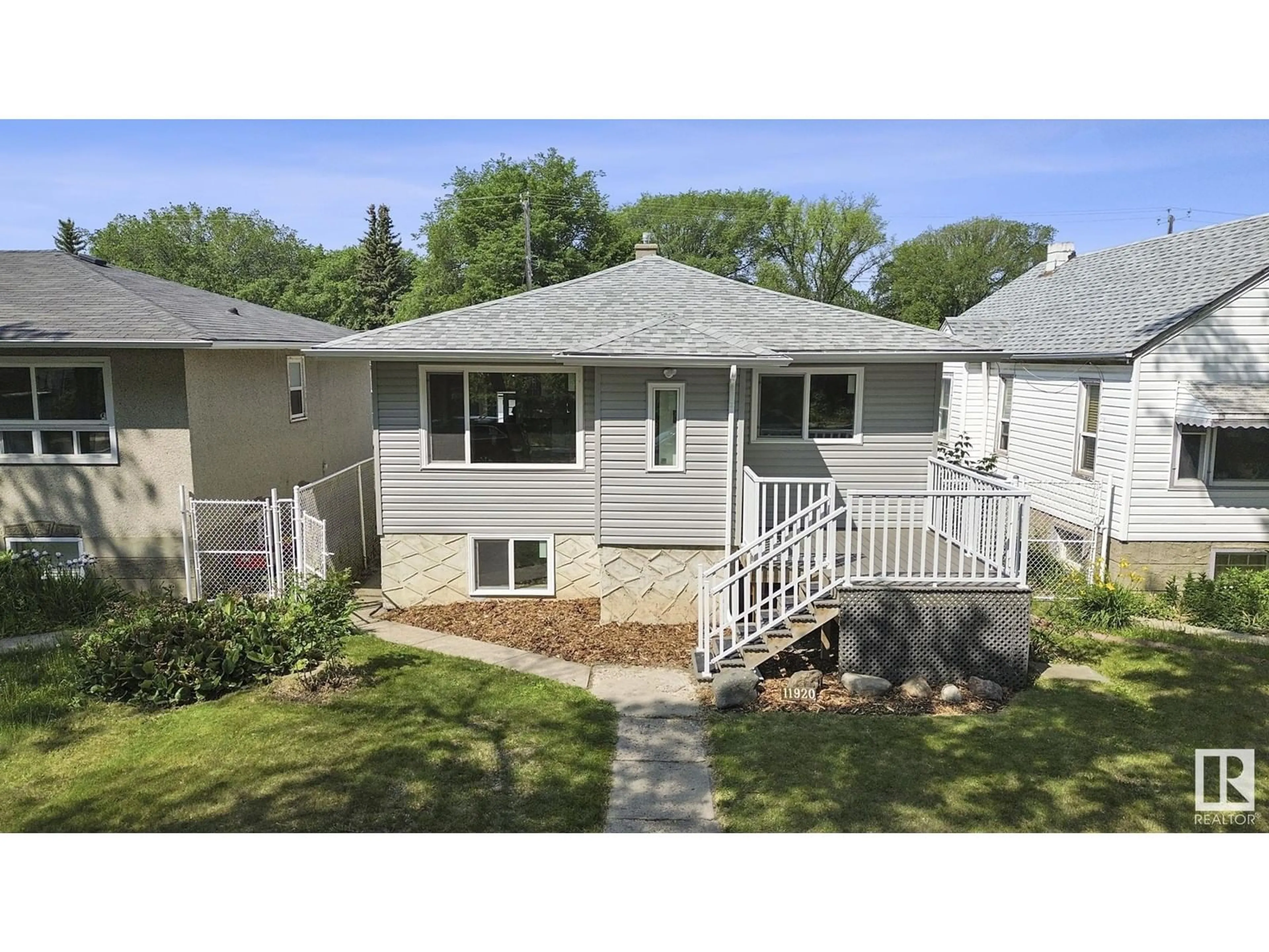 Home with vinyl exterior material, street for NW - 11920 69 ST, Edmonton Alberta T5B1S5