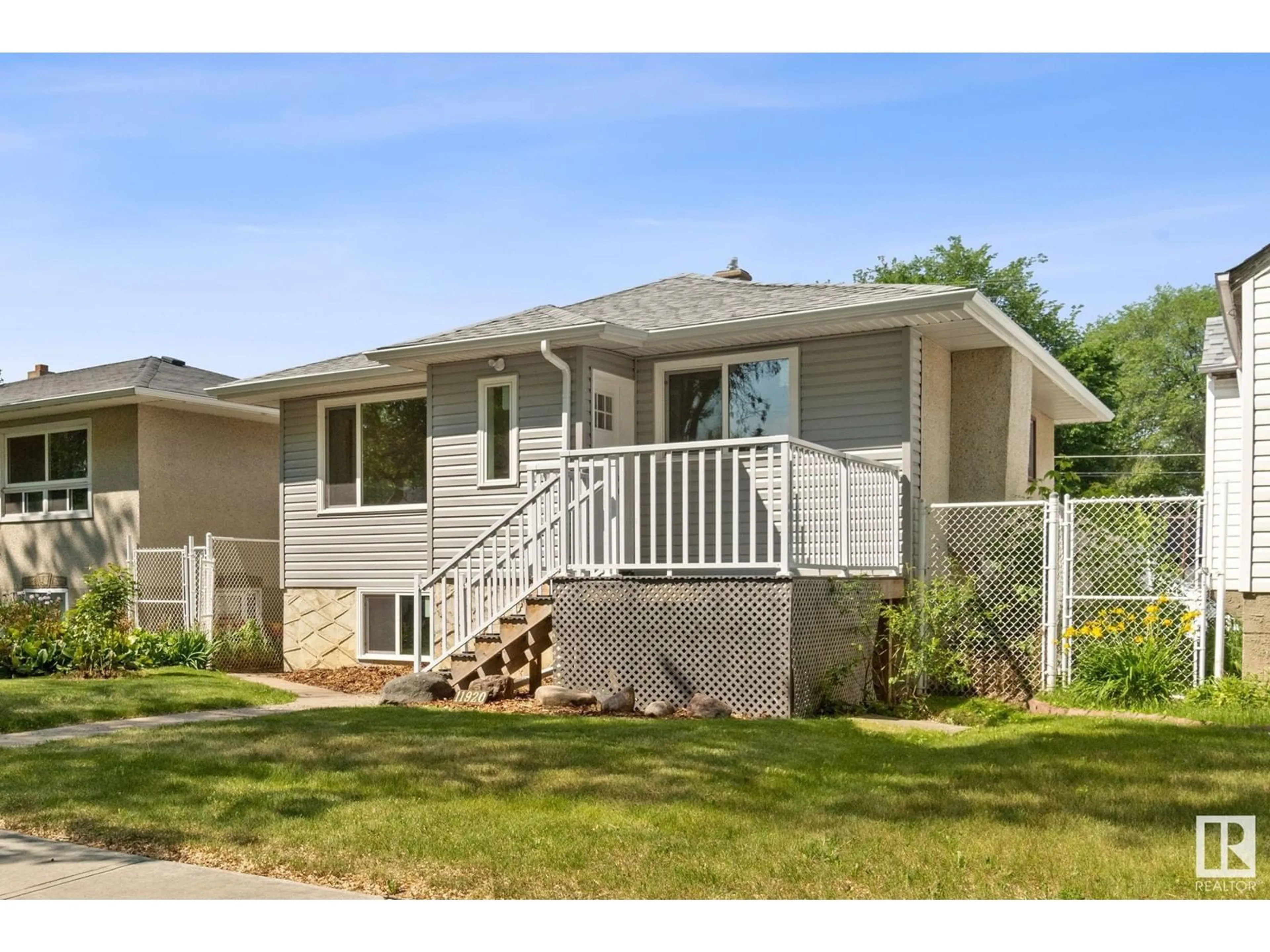 Home with vinyl exterior material, street for NW - 11920 69 ST, Edmonton Alberta T5B1S5