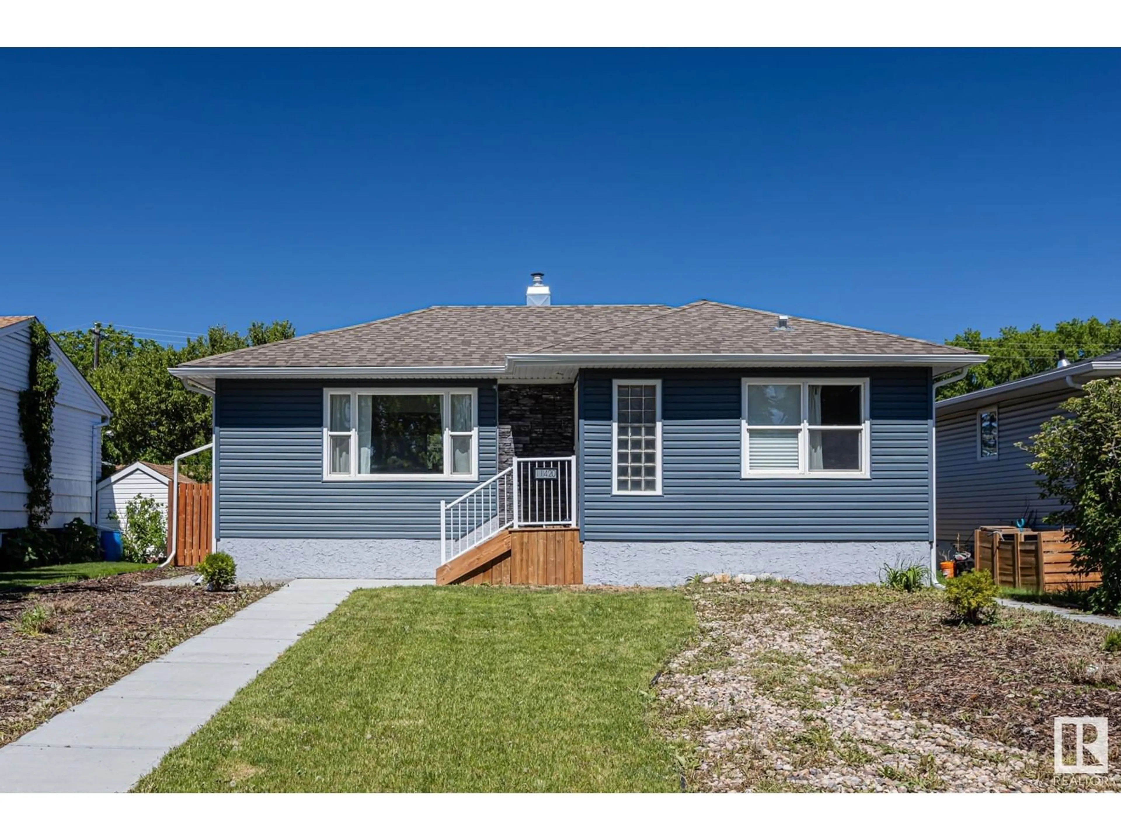 Home with vinyl exterior material, street for NW - 11420 112 AV, Edmonton Alberta T5G0H6