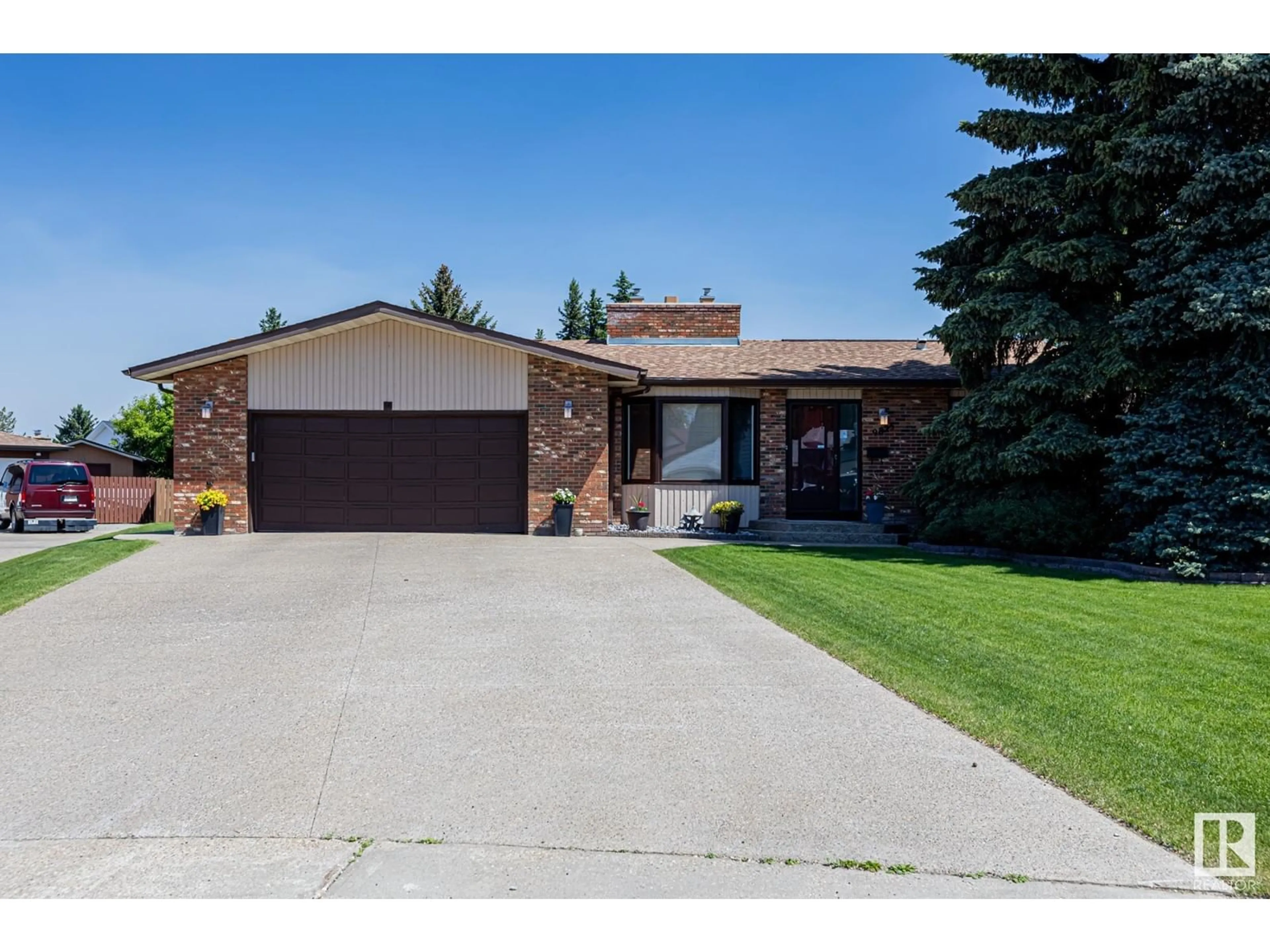 Home with brick exterior material, street for NW - 9825 187 ST, Edmonton Alberta T5T3E7