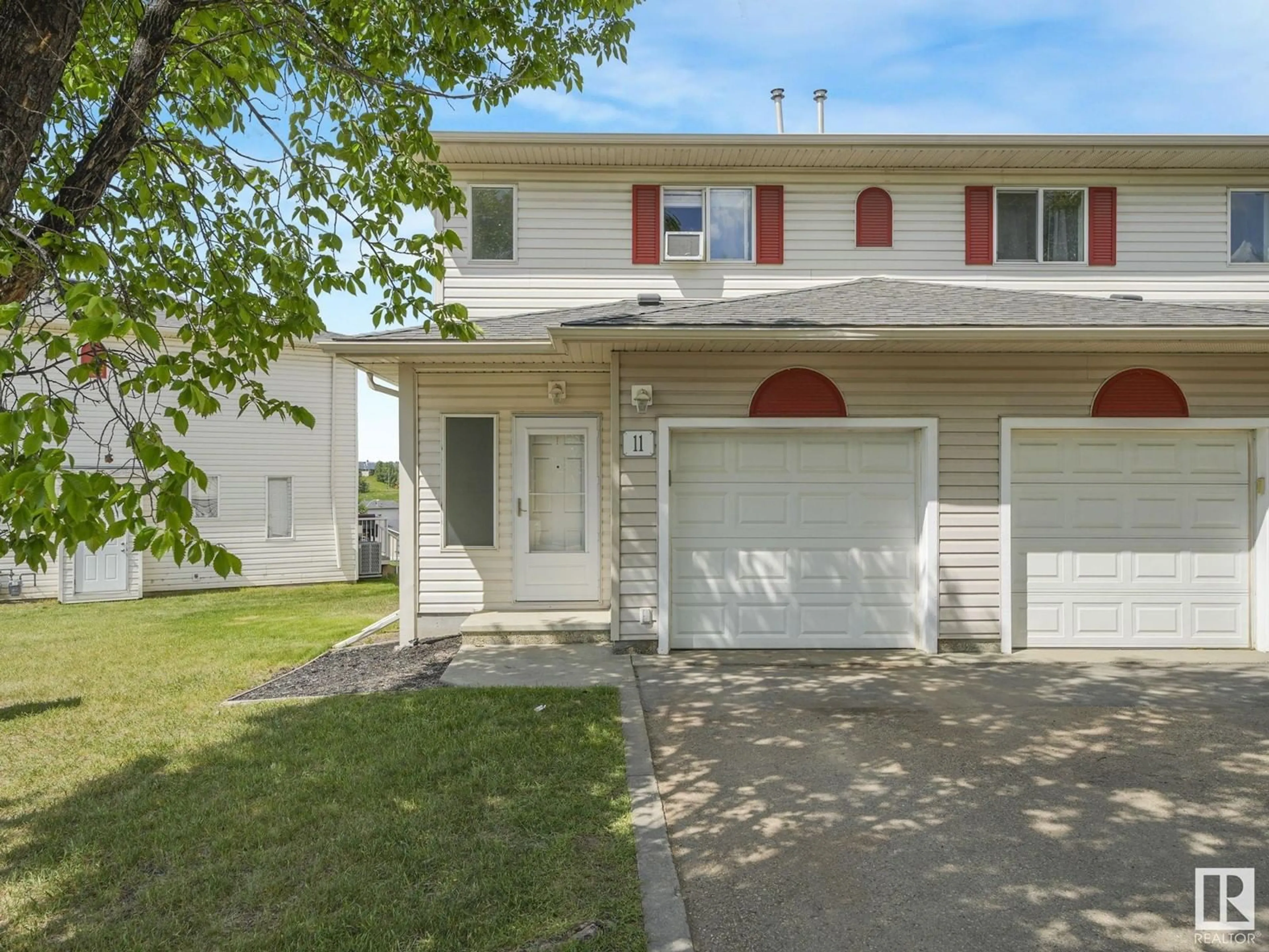 Home with vinyl exterior material, street for #11 - 451 HYNDMAN CR NW, Edmonton Alberta T5A5J3