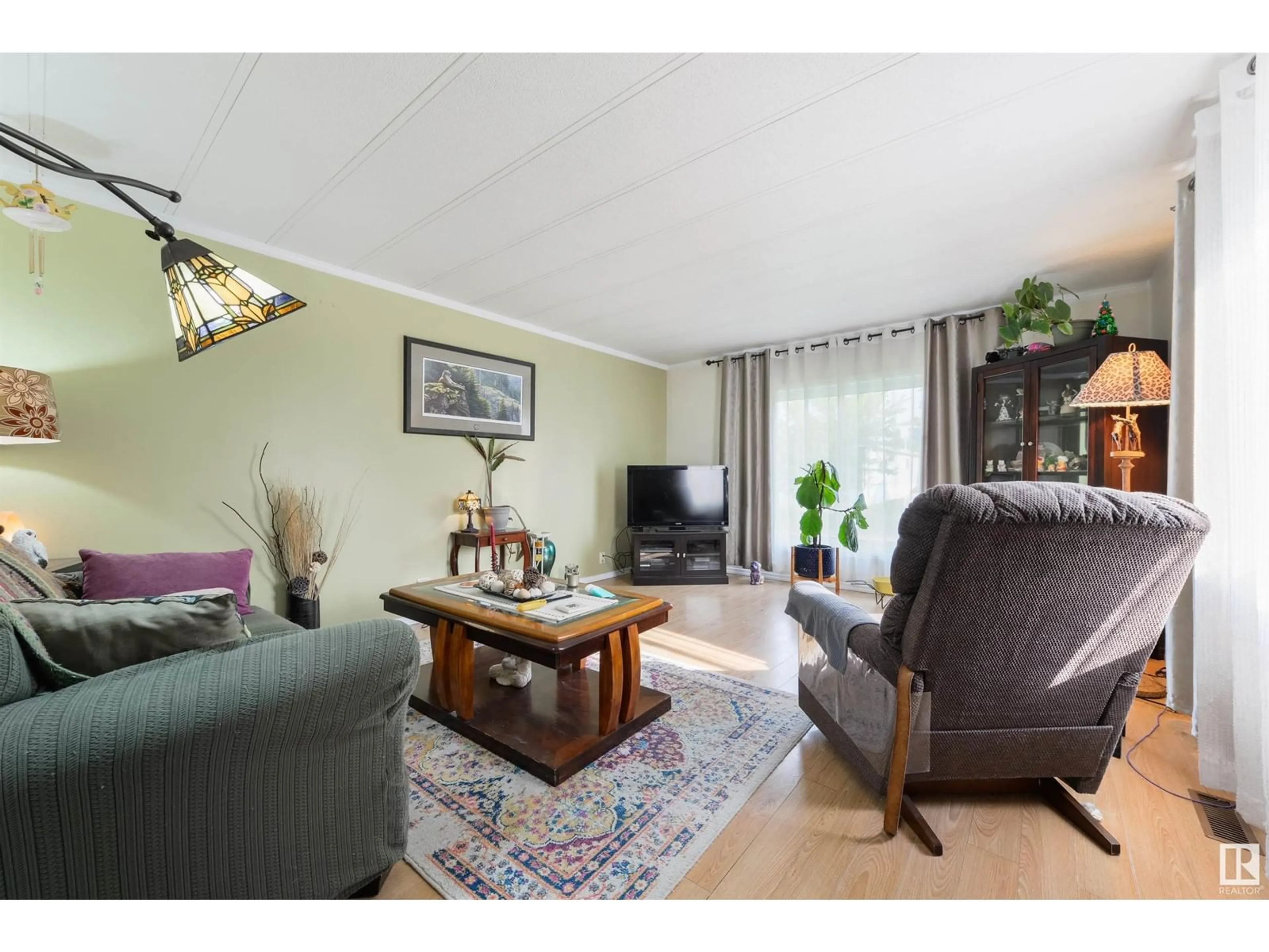 Living room with furniture, wood/laminate floor for 29 RIM RD, Edmonton Alberta T6P1C3