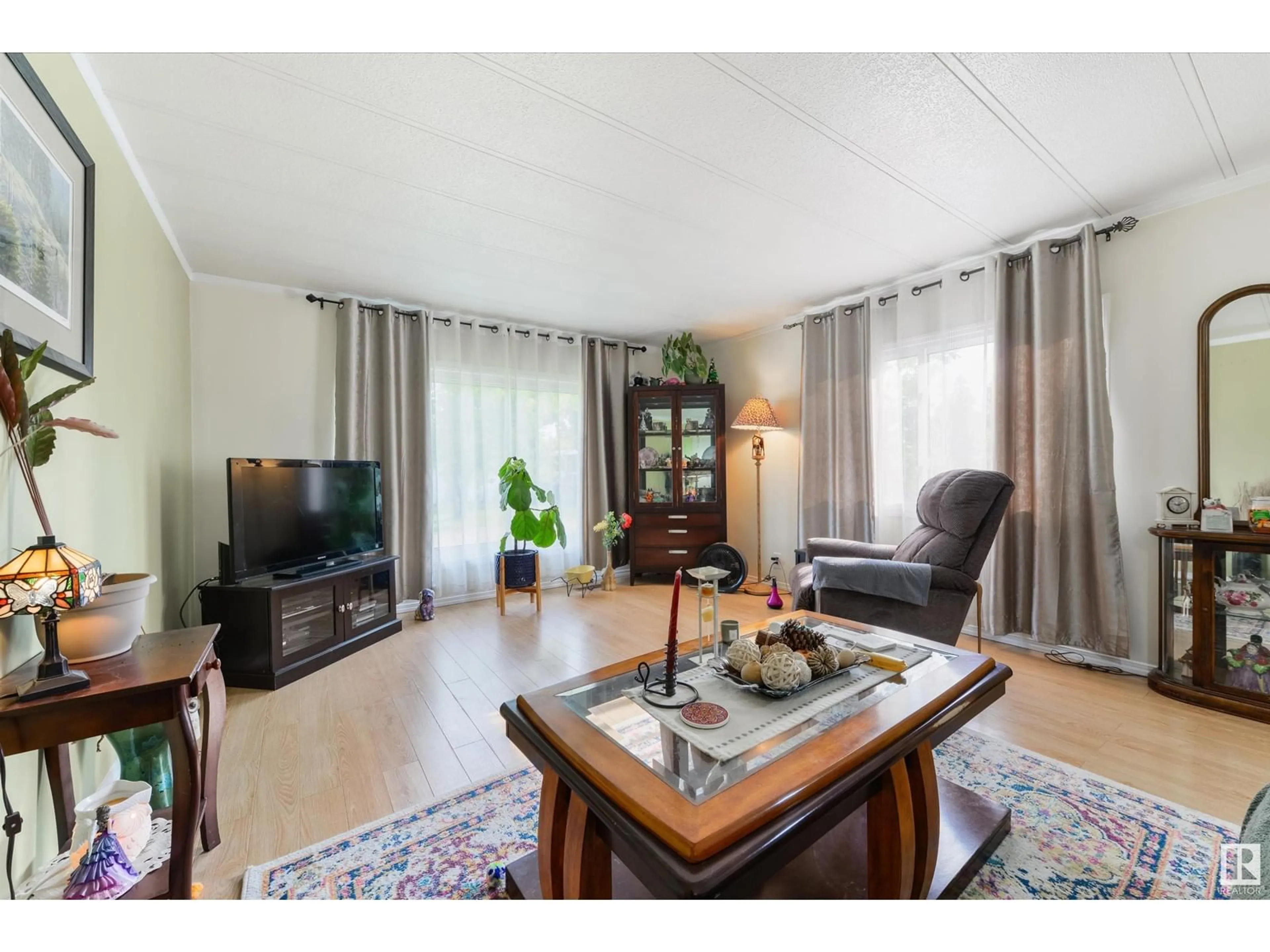 Living room with furniture, wood/laminate floor for 29 RIM RD, Edmonton Alberta T6P1C3