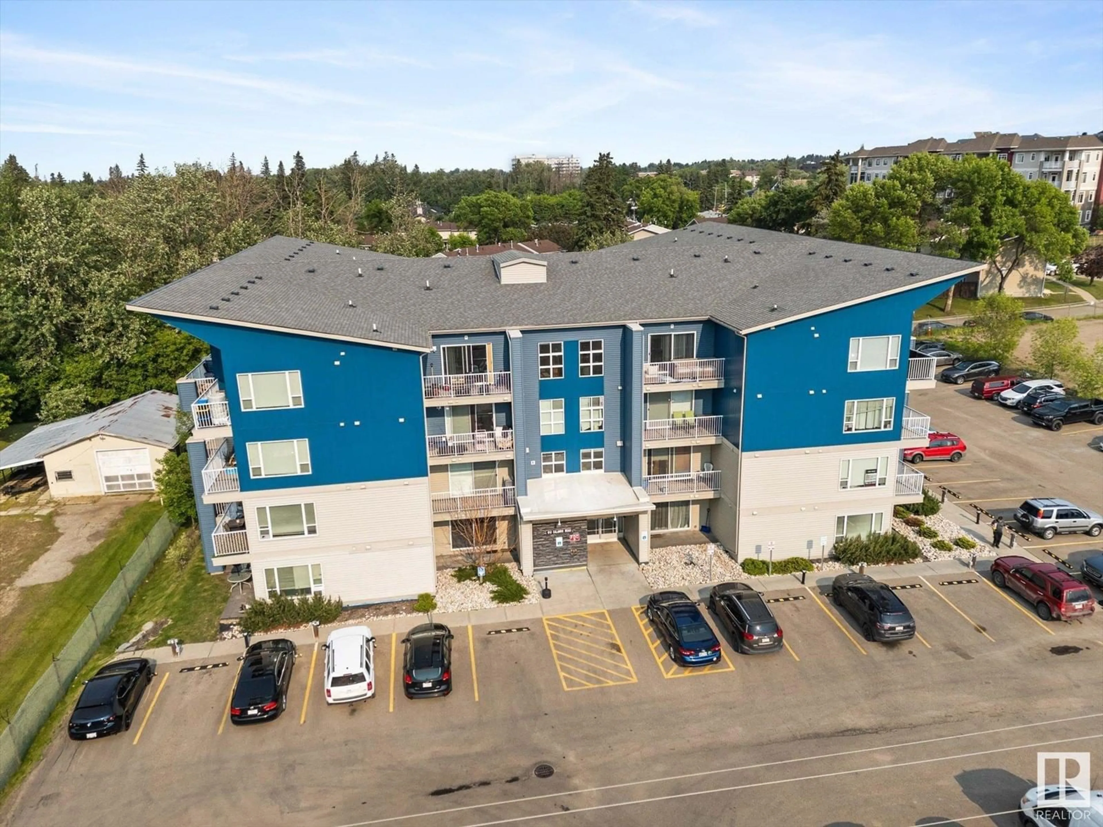 A pic from outside/outdoor area/front of a property/back of a property/a pic from drone, building for #214 - 610 CALAHOO RD, Spruce Grove Alberta T7X1R1