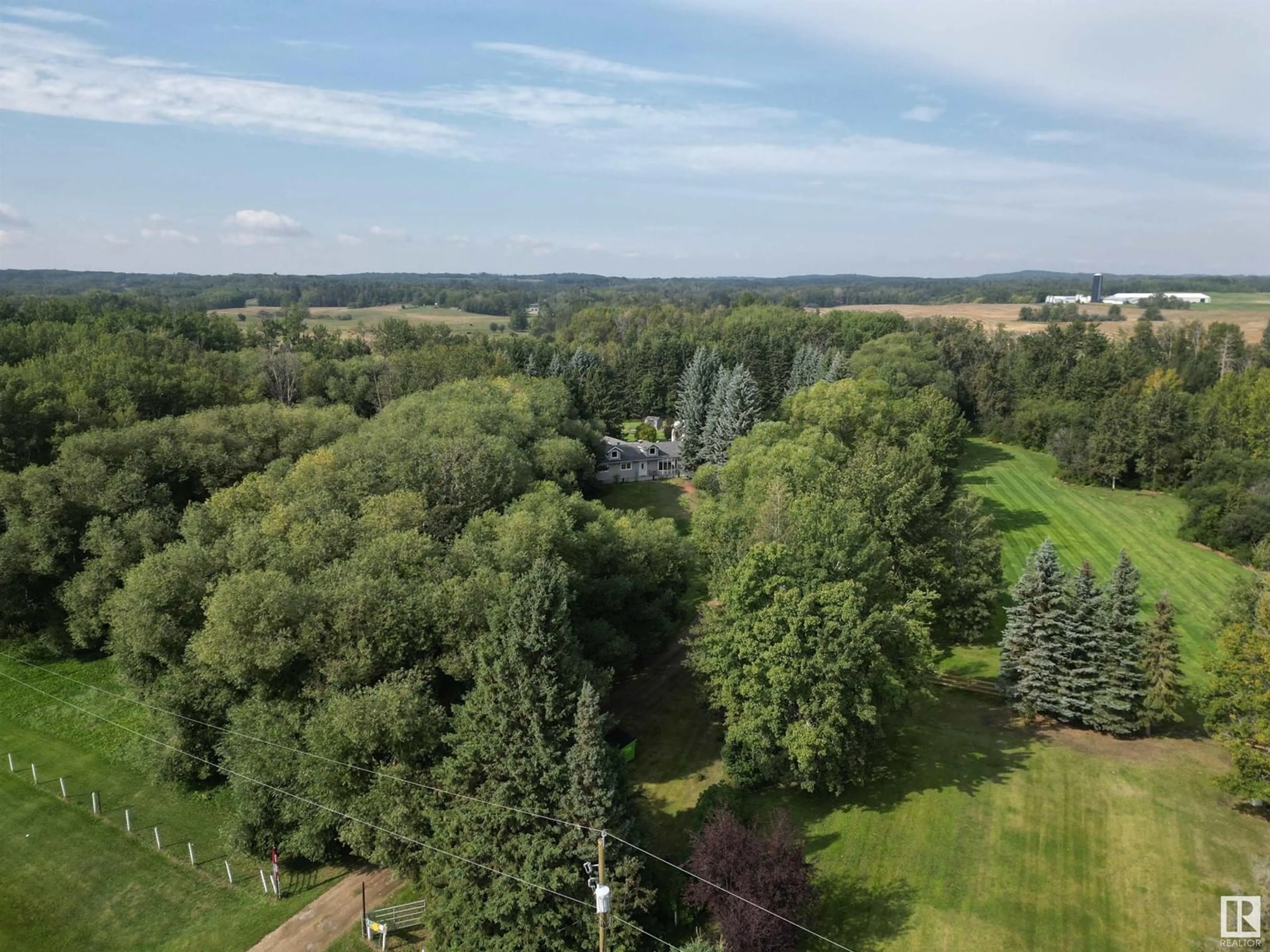 A pic from outside/outdoor area/front of a property/back of a property/a pic from drone, forest/trees view for 53306 HGHWAY 779, Rural Parkland County Alberta T7Y0A1