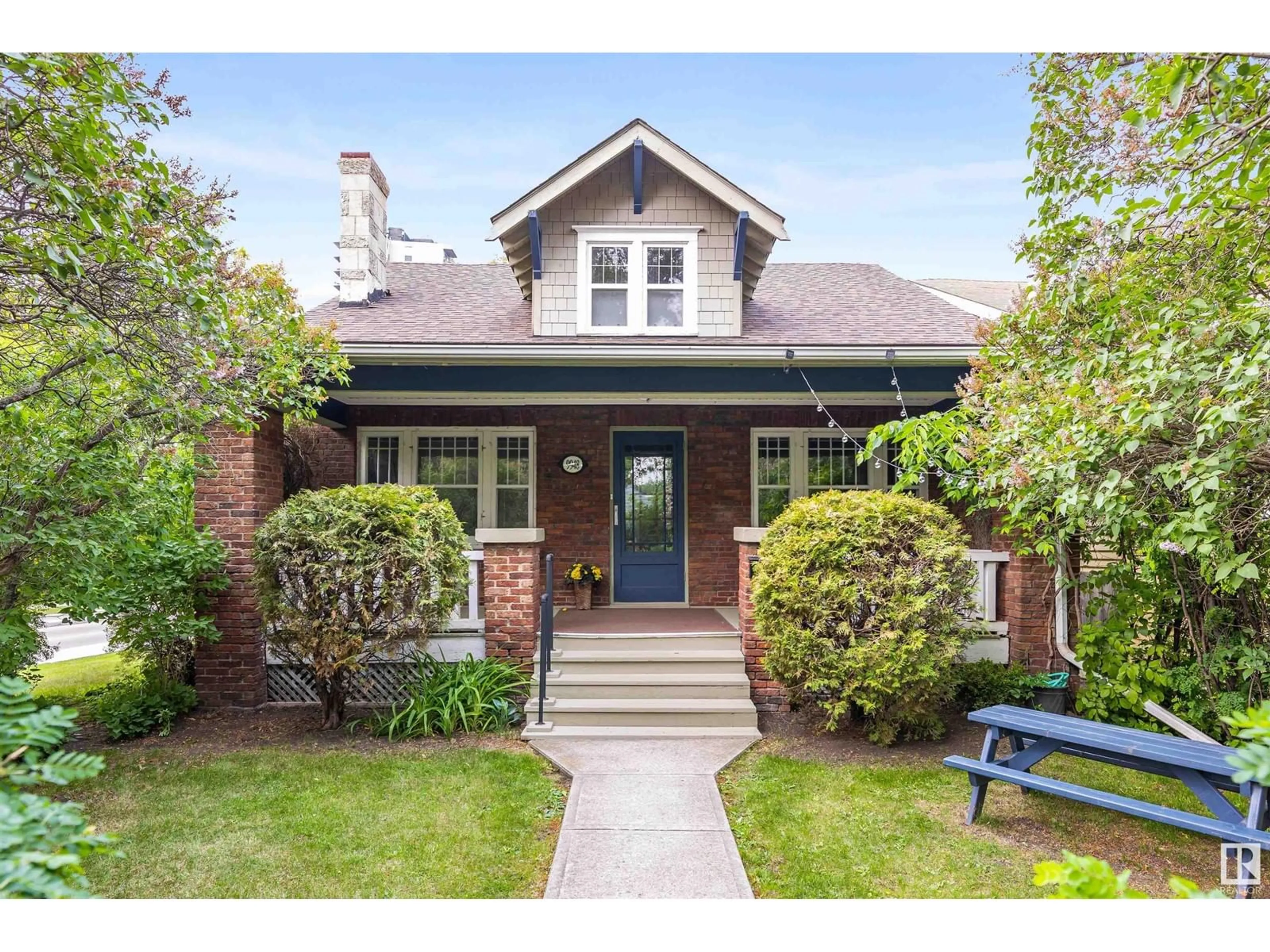 Home with brick exterior material, street for NW - 9948 88 AV, Edmonton Alberta T6E4R4