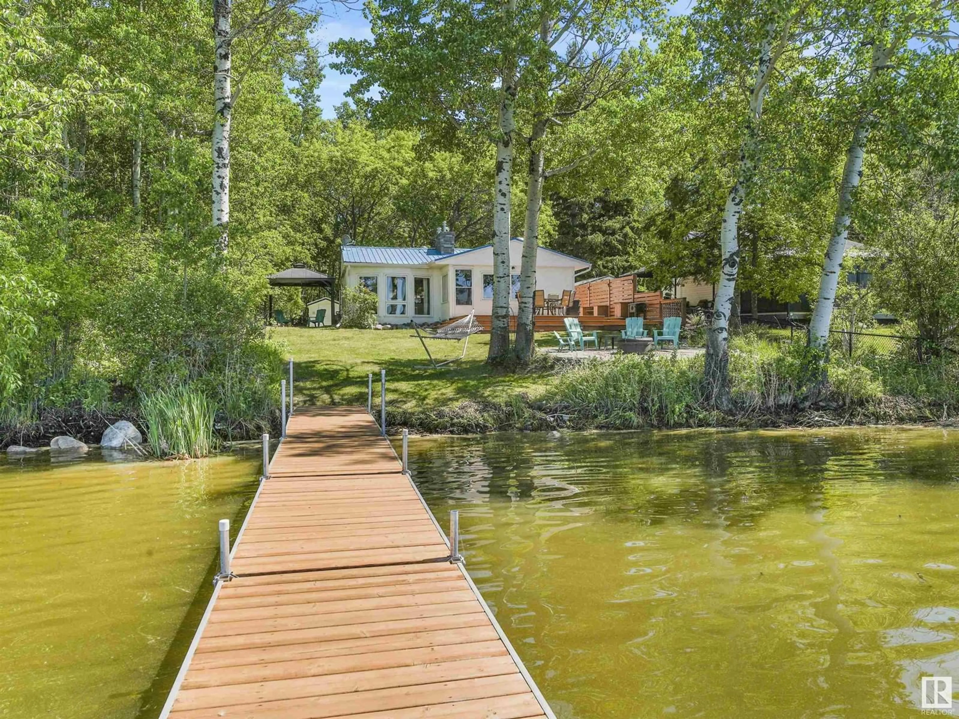 A pic from outside/outdoor area/front of a property/back of a property/a pic from drone, water/lake/river/ocean view for 13 CONIFER CR, Rural Lac Ste. Anne County Alberta T0E1H0
