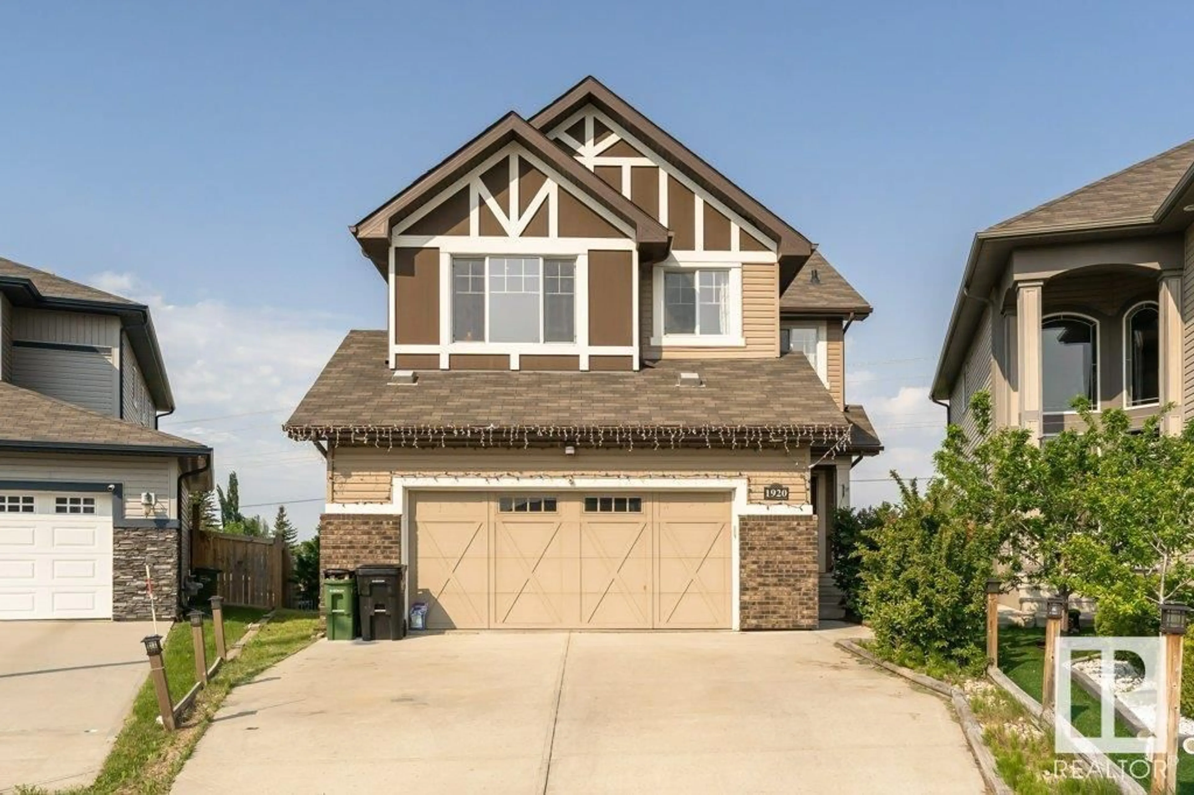 Home with vinyl exterior material, street for NW - 1920 33B ST, Edmonton Alberta T6T0L3
