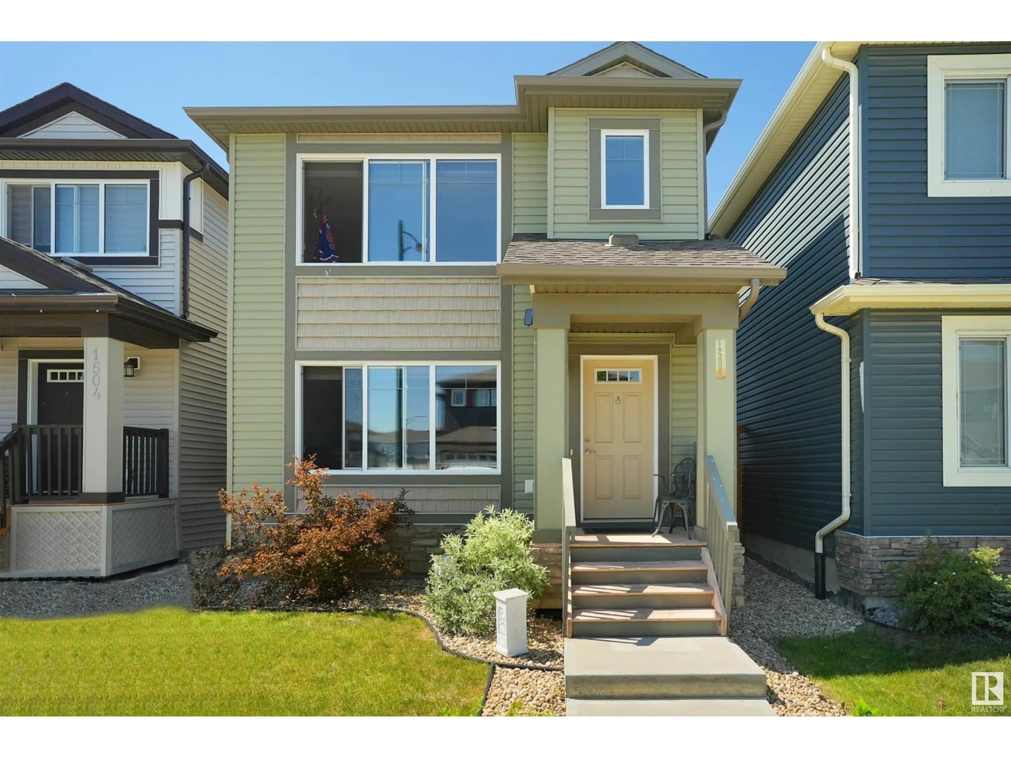 Home with vinyl exterior material, street for NW - 1508 21 ST, Edmonton Alberta T6T1B2