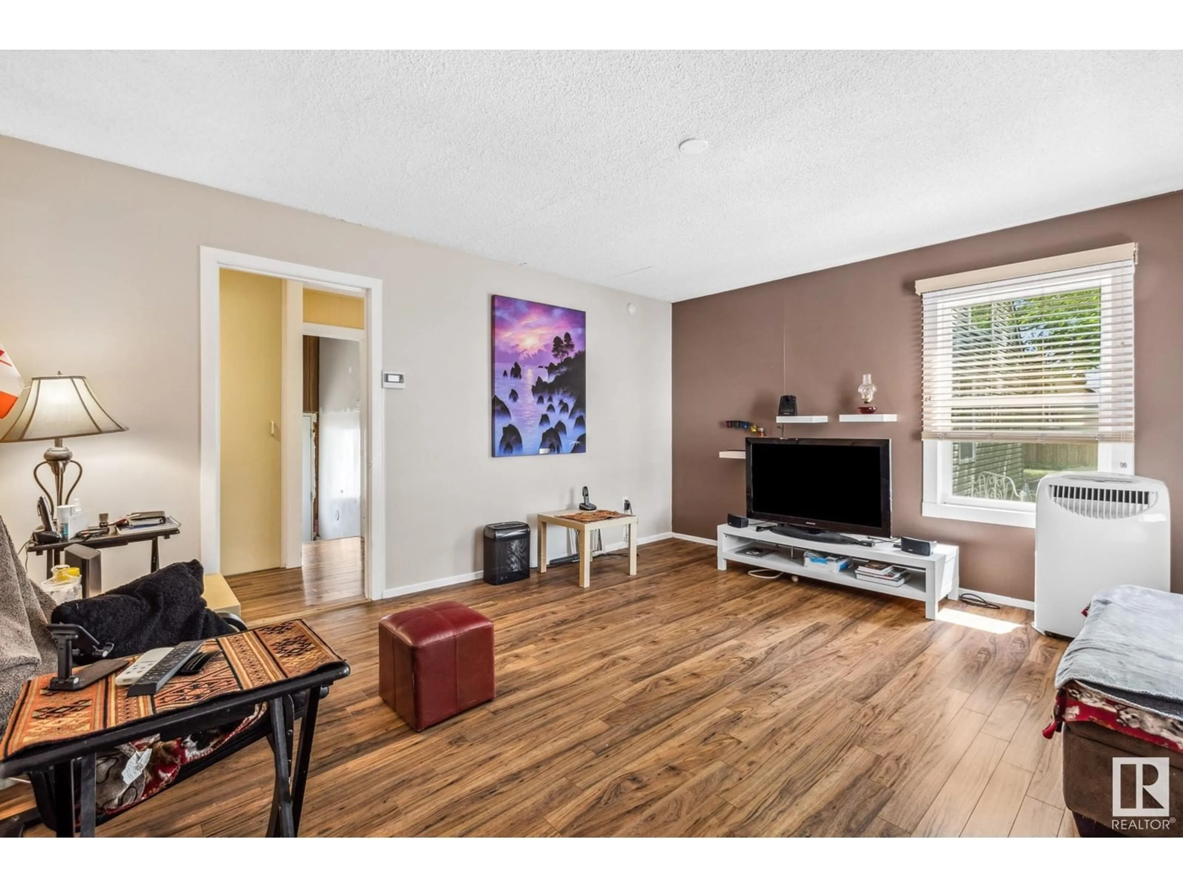 Living room with furniture, wood/laminate floor for NW - 11607 87 ST, Edmonton Alberta T5B3M6