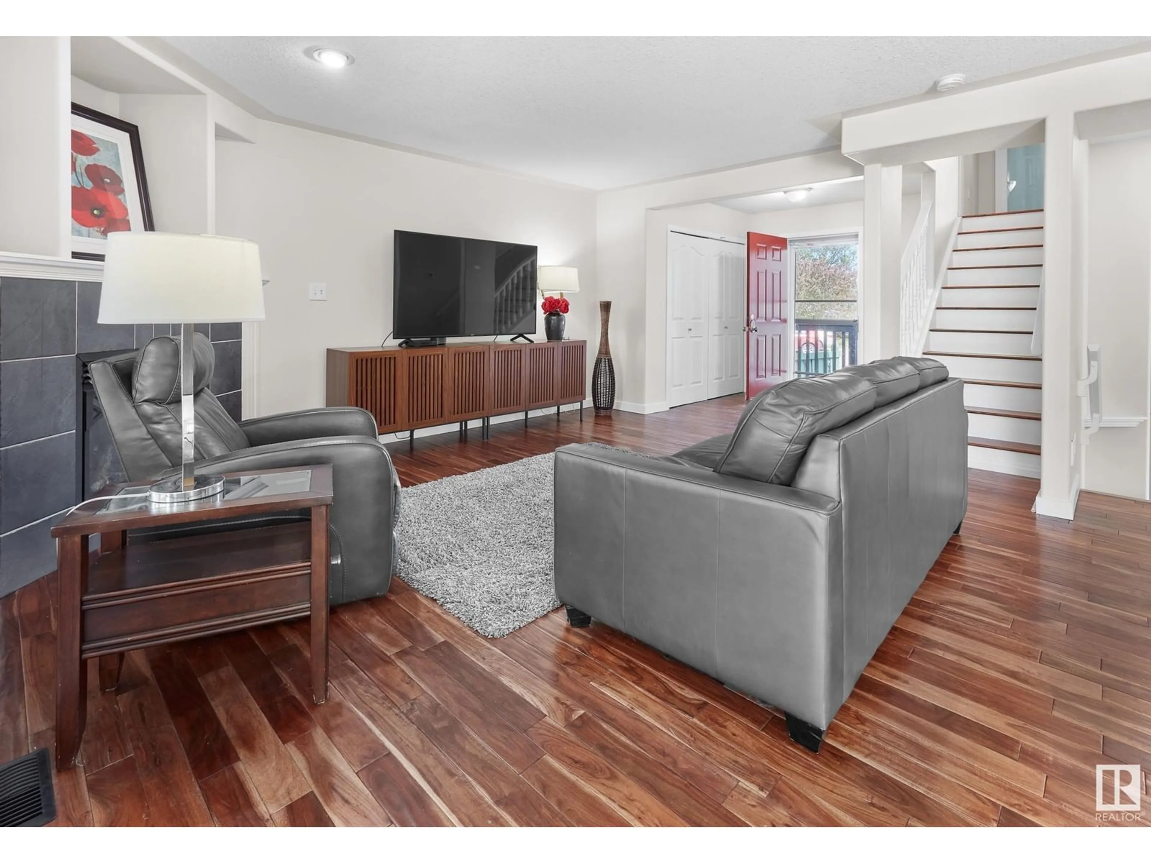 Living room with furniture, wood/laminate floor for 439 HUNTERS GREEN GR, Edmonton Alberta T6R3C1