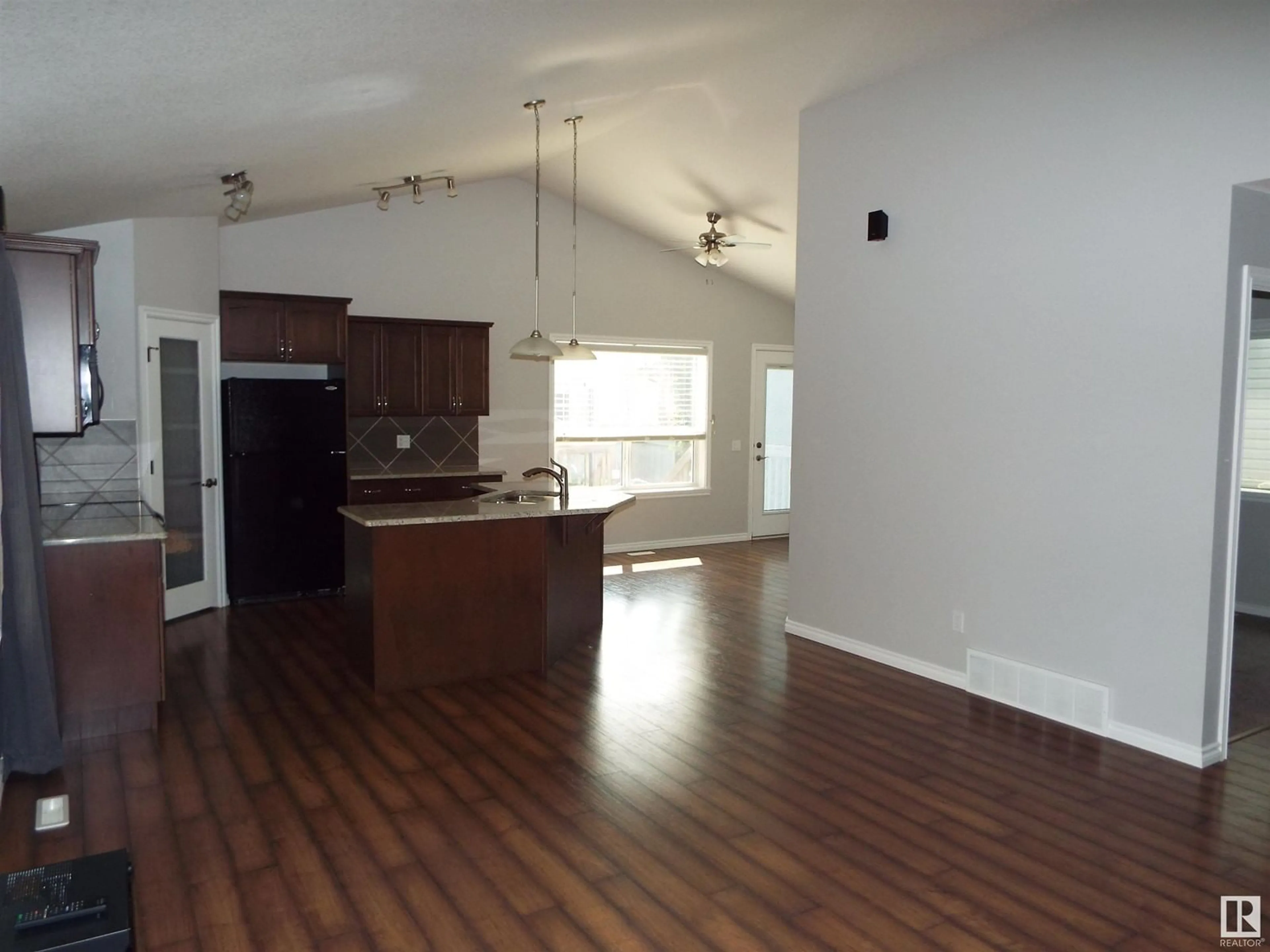 Open concept kitchen, wood/laminate floor for 145 SELKIRK PL, Leduc Alberta T9E0L6