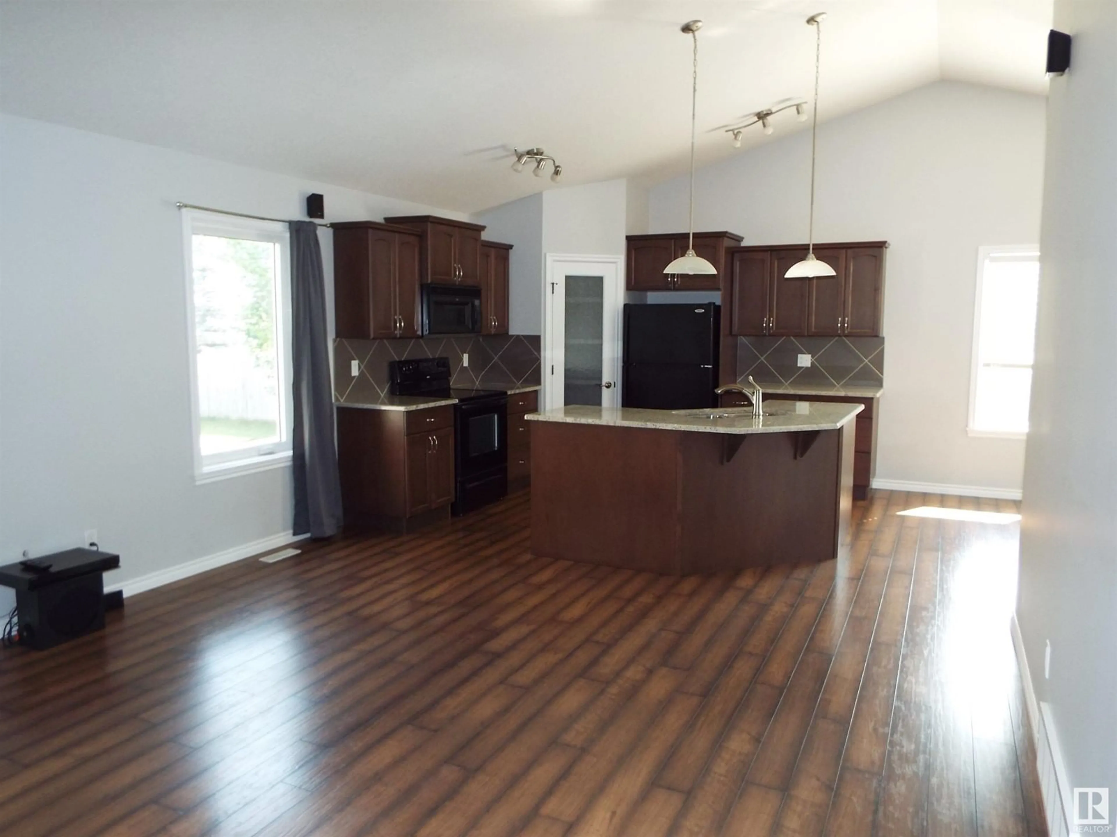 Open concept kitchen, wood/laminate floor for 145 SELKIRK PL, Leduc Alberta T9E0L6