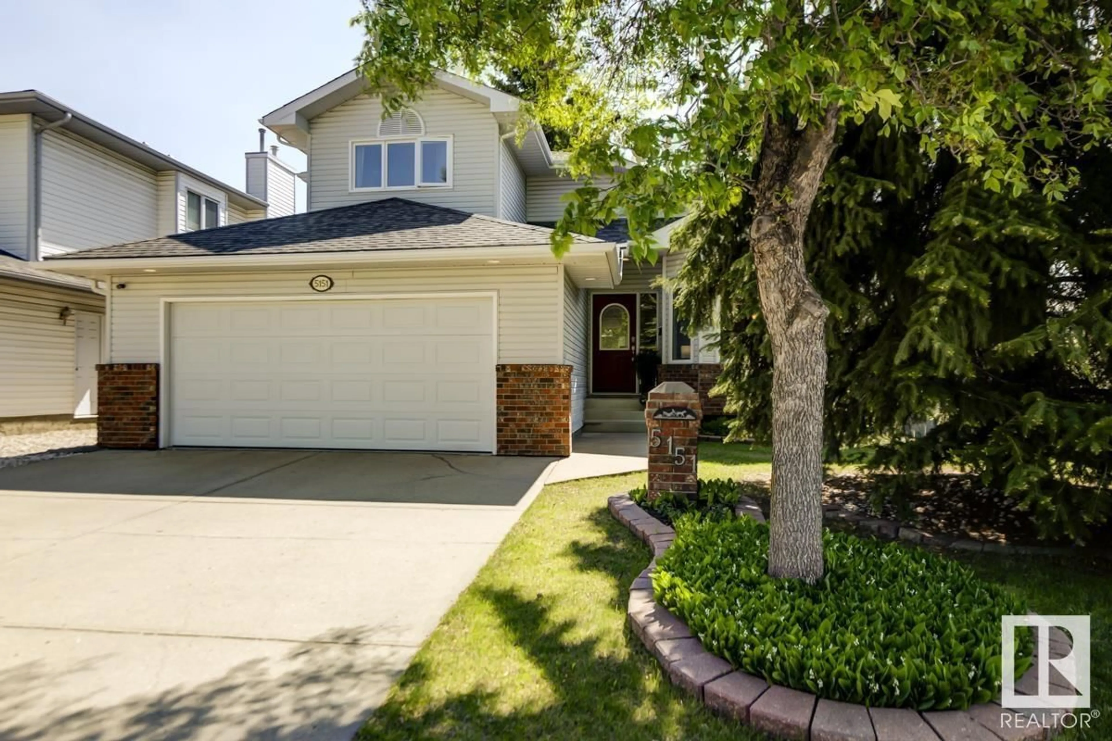 Home with vinyl exterior material, street for 5151 189 ST, Edmonton Alberta T6M2L1