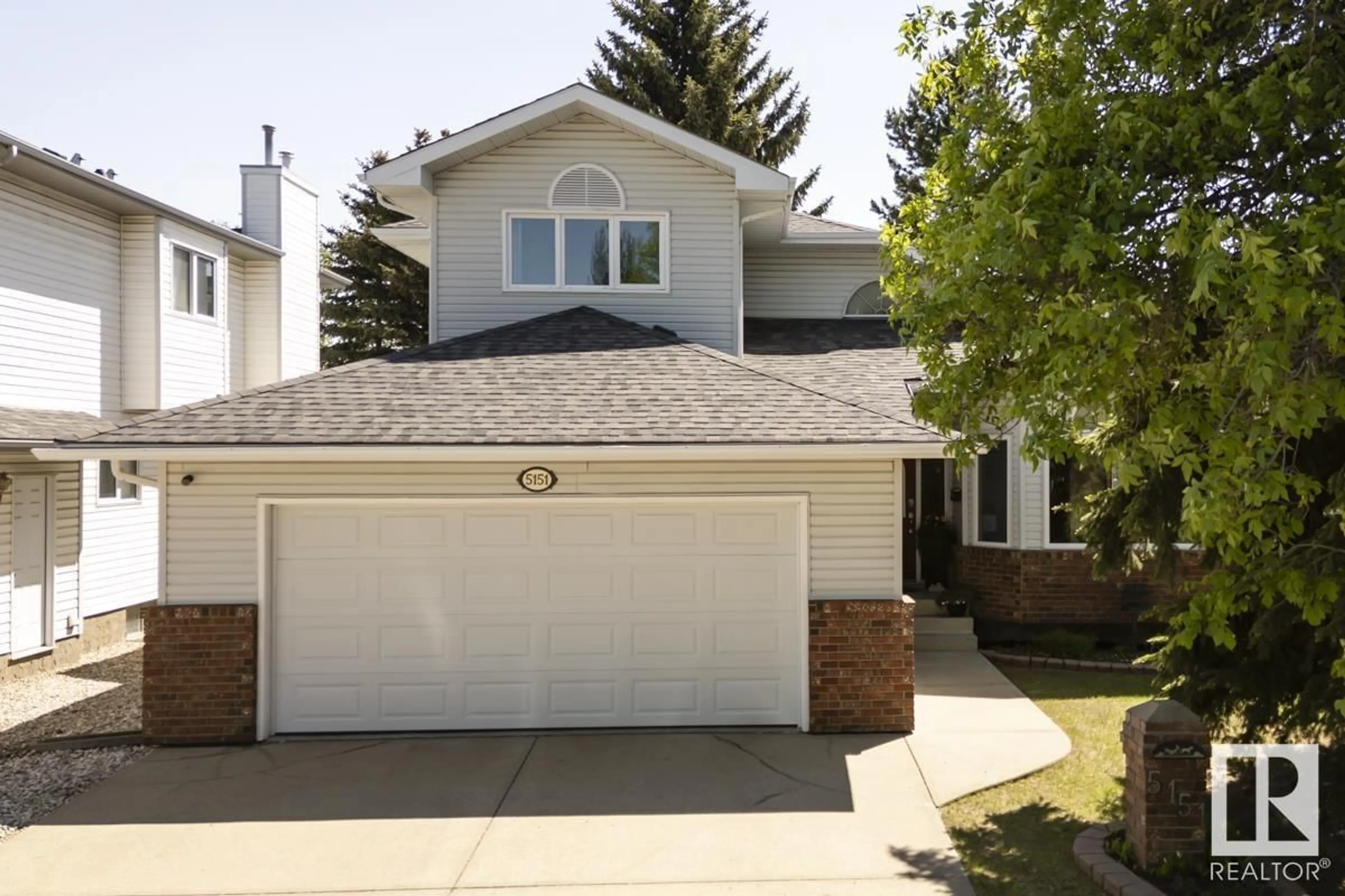 Home with vinyl exterior material, street for 5151 189 ST, Edmonton Alberta T6M2L1