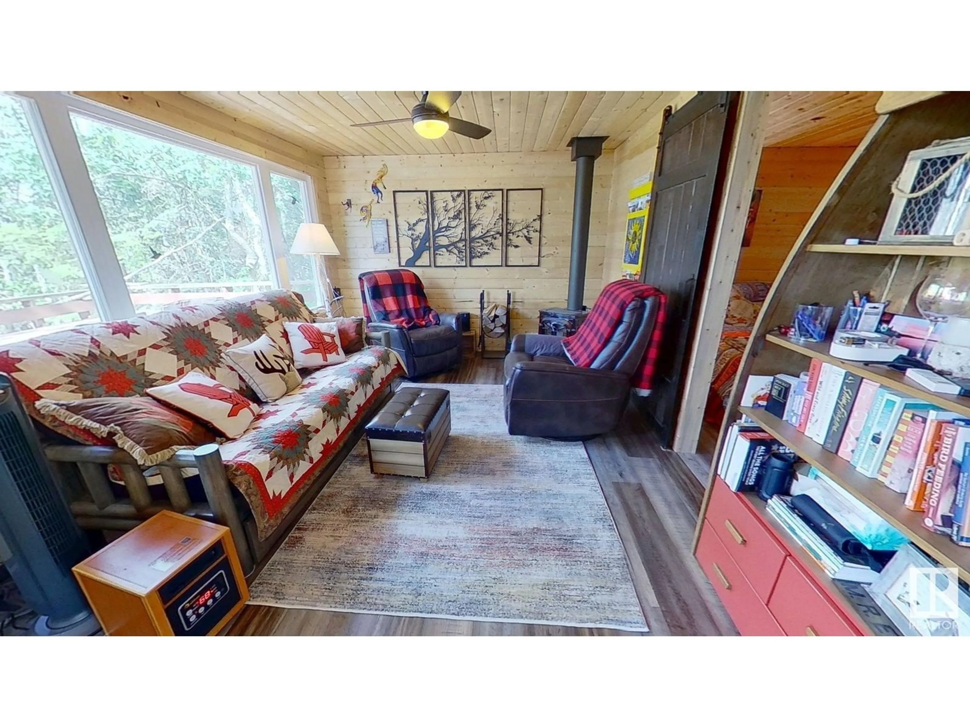 Living room with furniture, wood/laminate floor for 51268 - 241 RGE ROAD 204, Rural Strathcona County Alberta T8G1E9