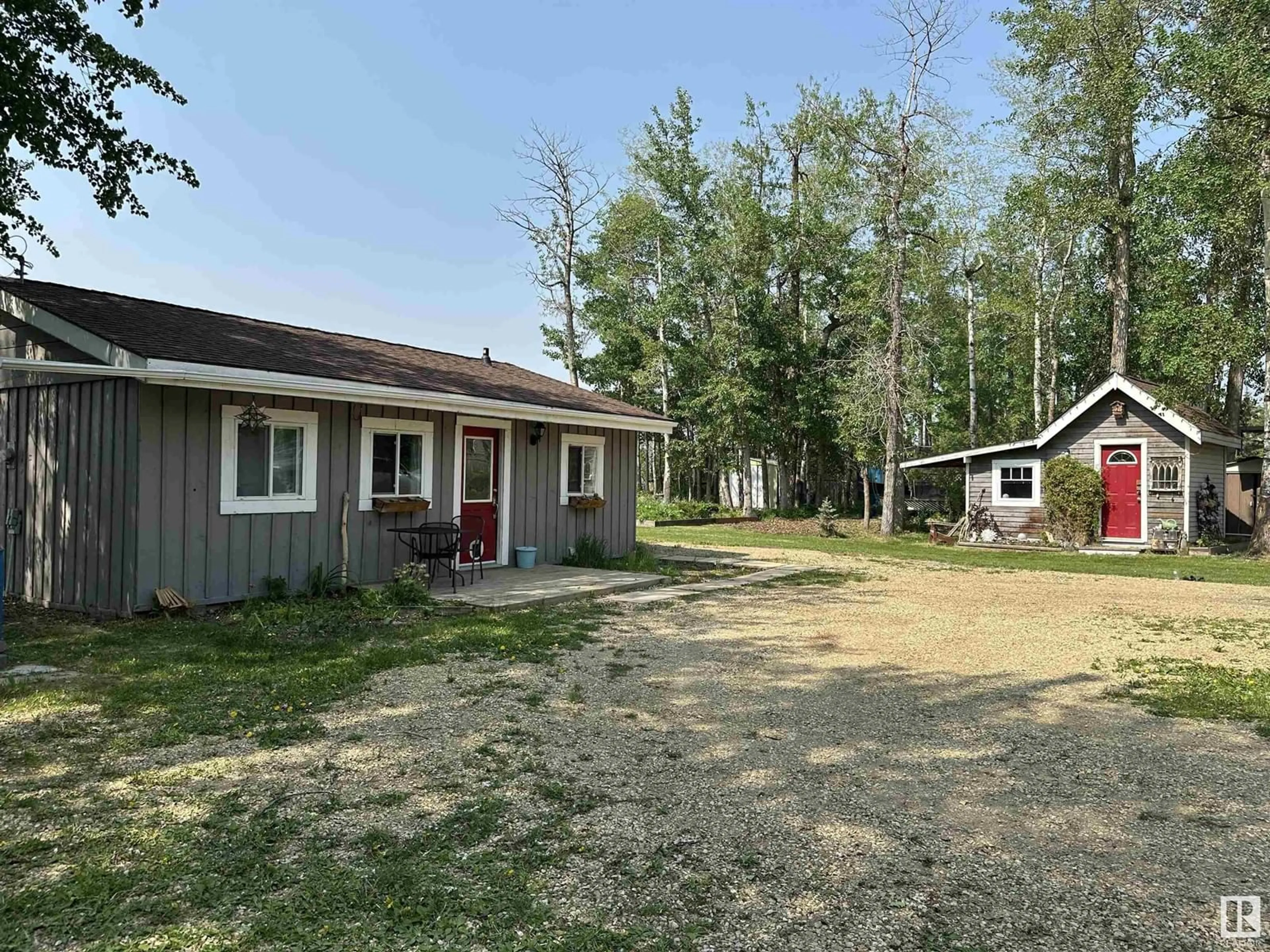 A pic from outside/outdoor area/front of a property/back of a property/a pic from drone, street for 70 - 52343 RGE ROAD 211, Rural Strathcona County Alberta T8G1A6