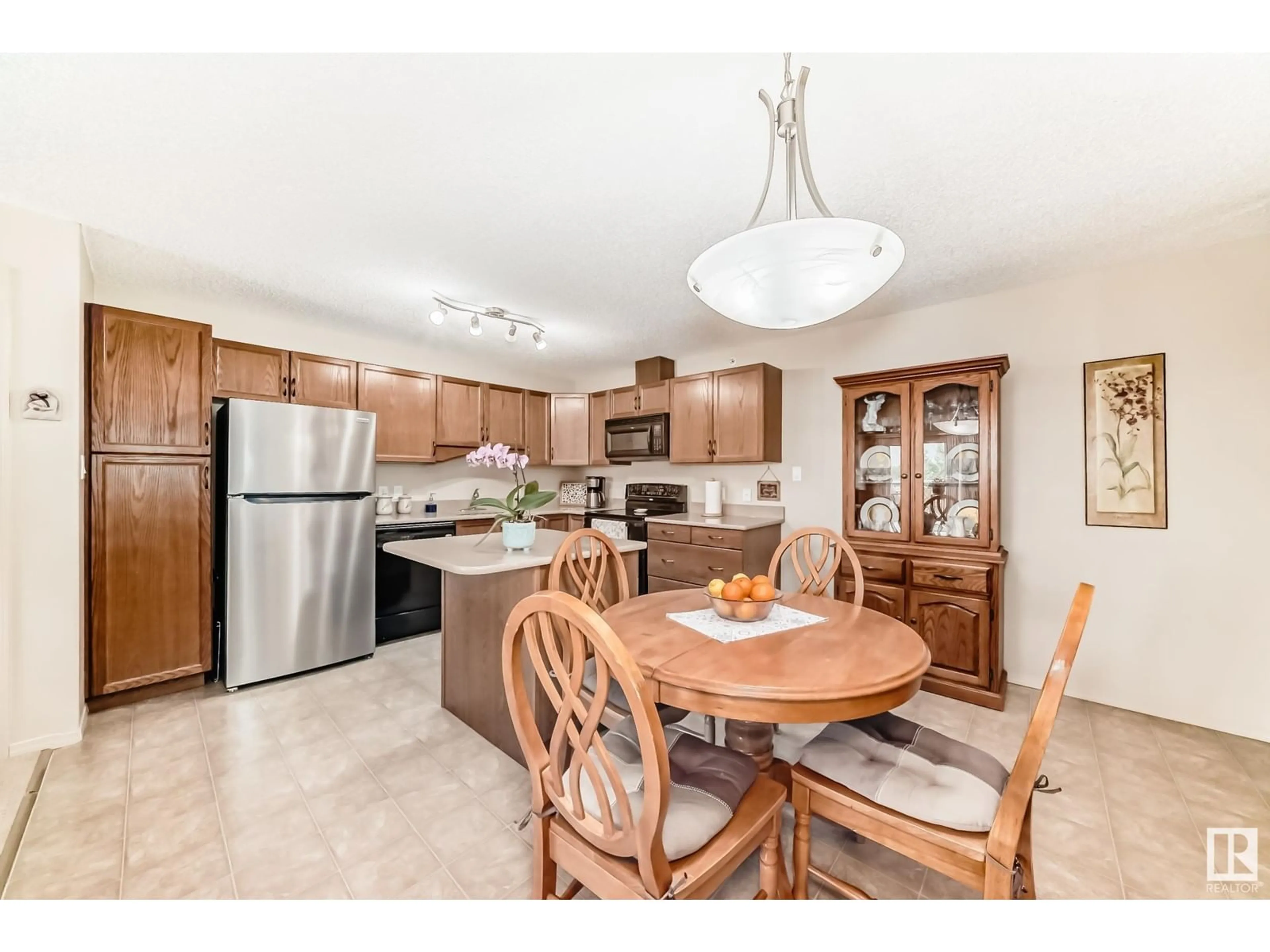 Open concept kitchen, ceramic/tile floor for #435 - 16035 132 ST NW, Edmonton Alberta T6V0B4