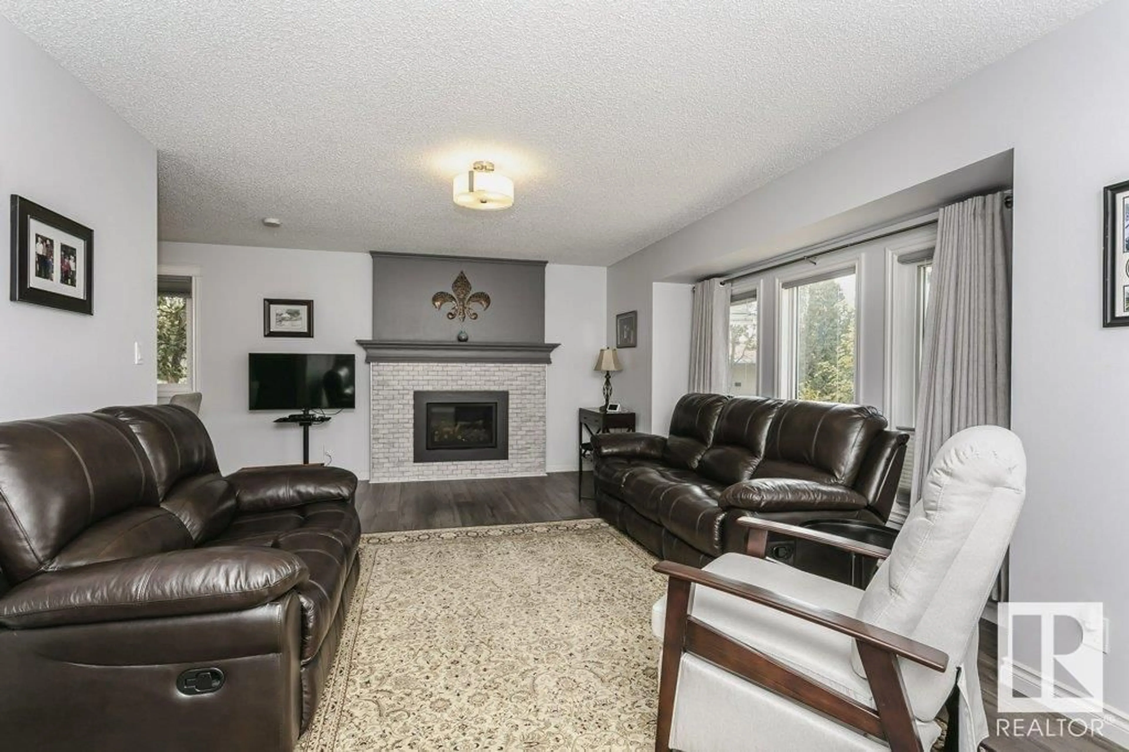 Living room with furniture, unknown for NW - 8613 29 AV, Edmonton Alberta T6K2X5