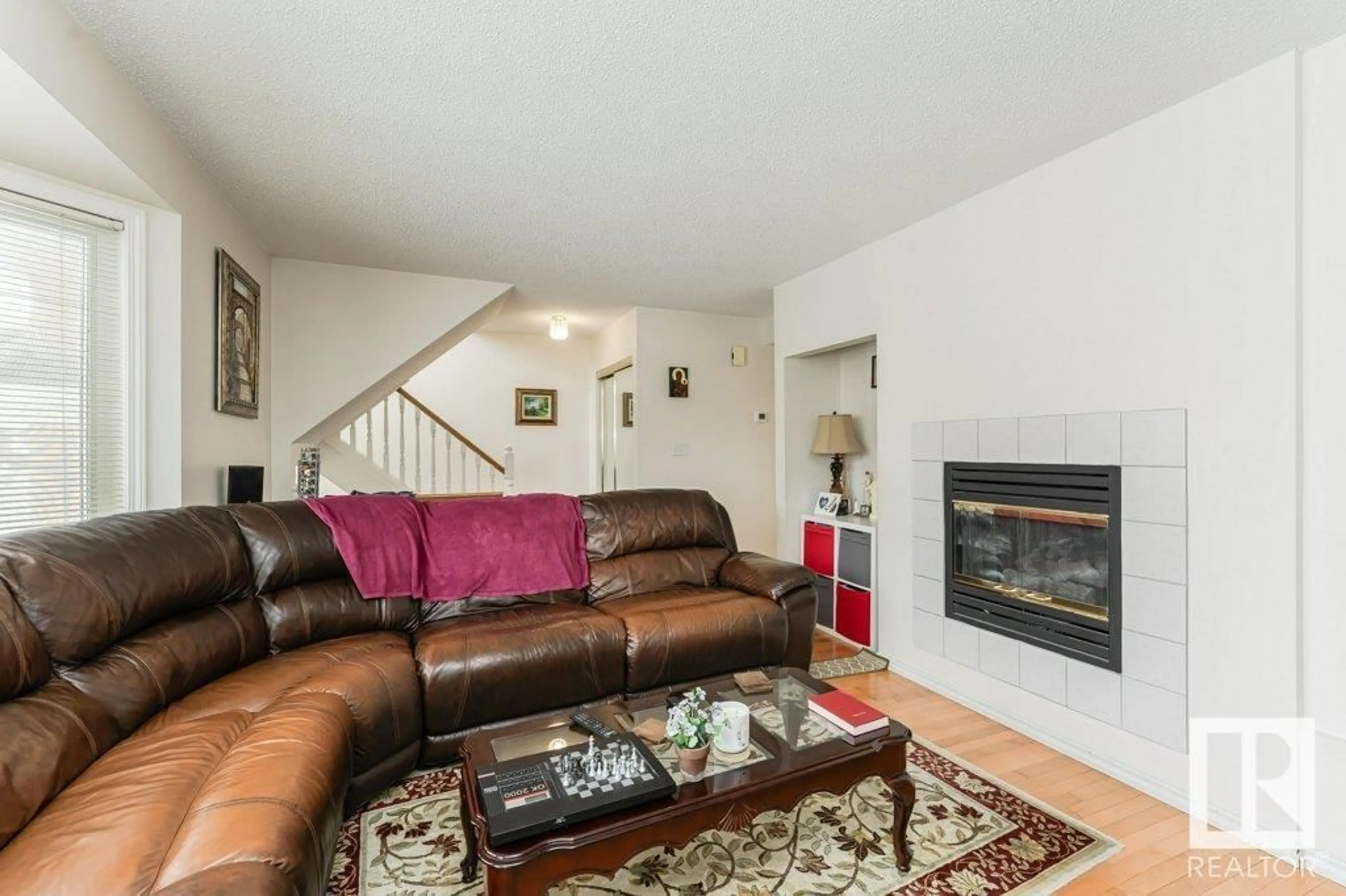 Living room with furniture, unknown for 124 11115 9 AV, Edmonton Alberta T6J6Z1