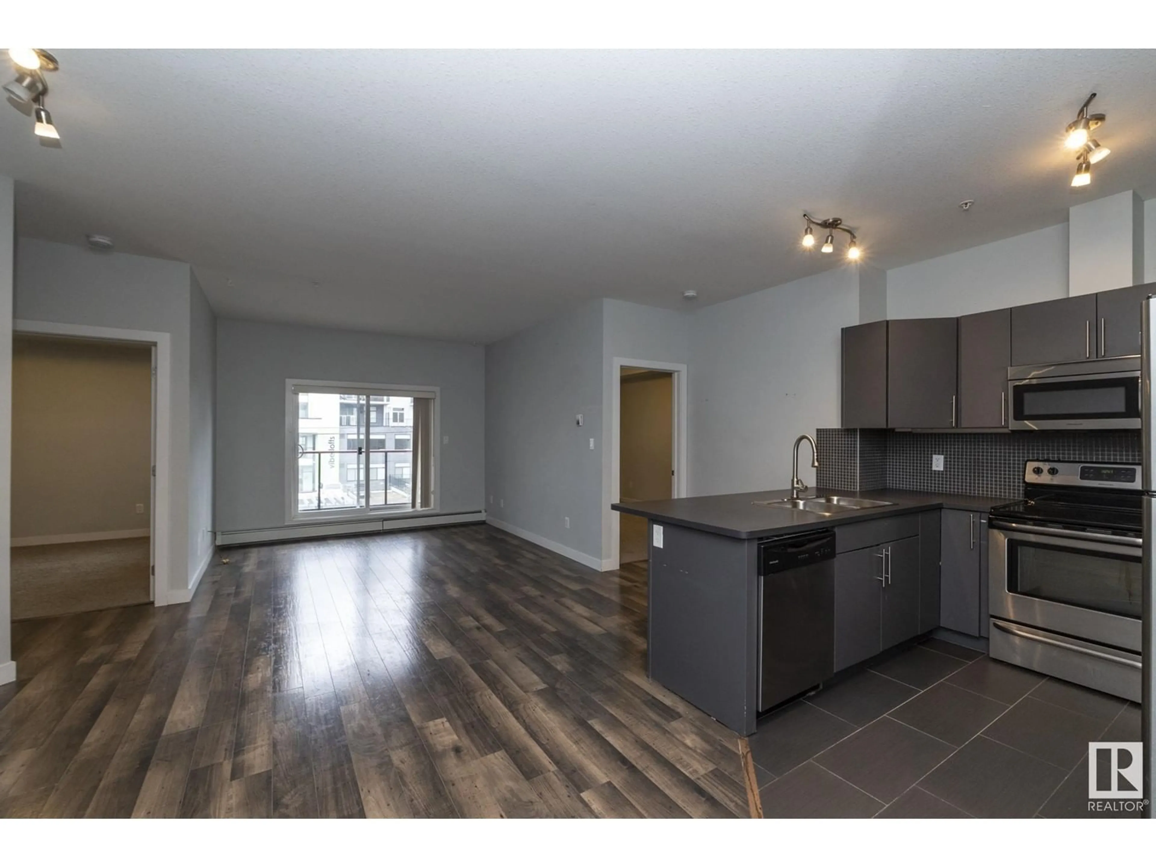 Open concept kitchen, wood/laminate floor for 207 - 10611 117 ST, Edmonton Alberta T5H0G6