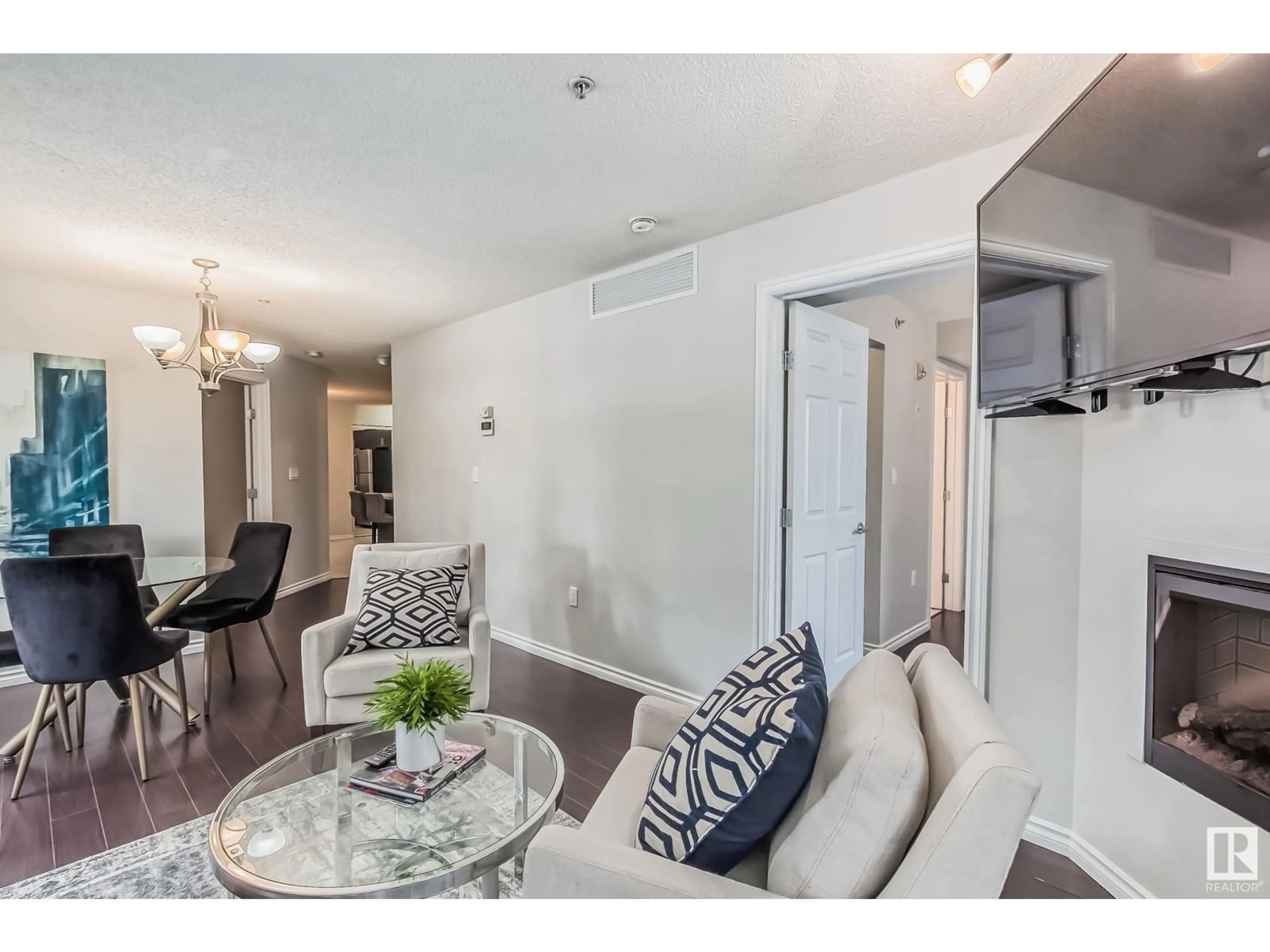 Living room with furniture, unknown for 115 10118 106 AVE NW, Edmonton Alberta T5H0B8