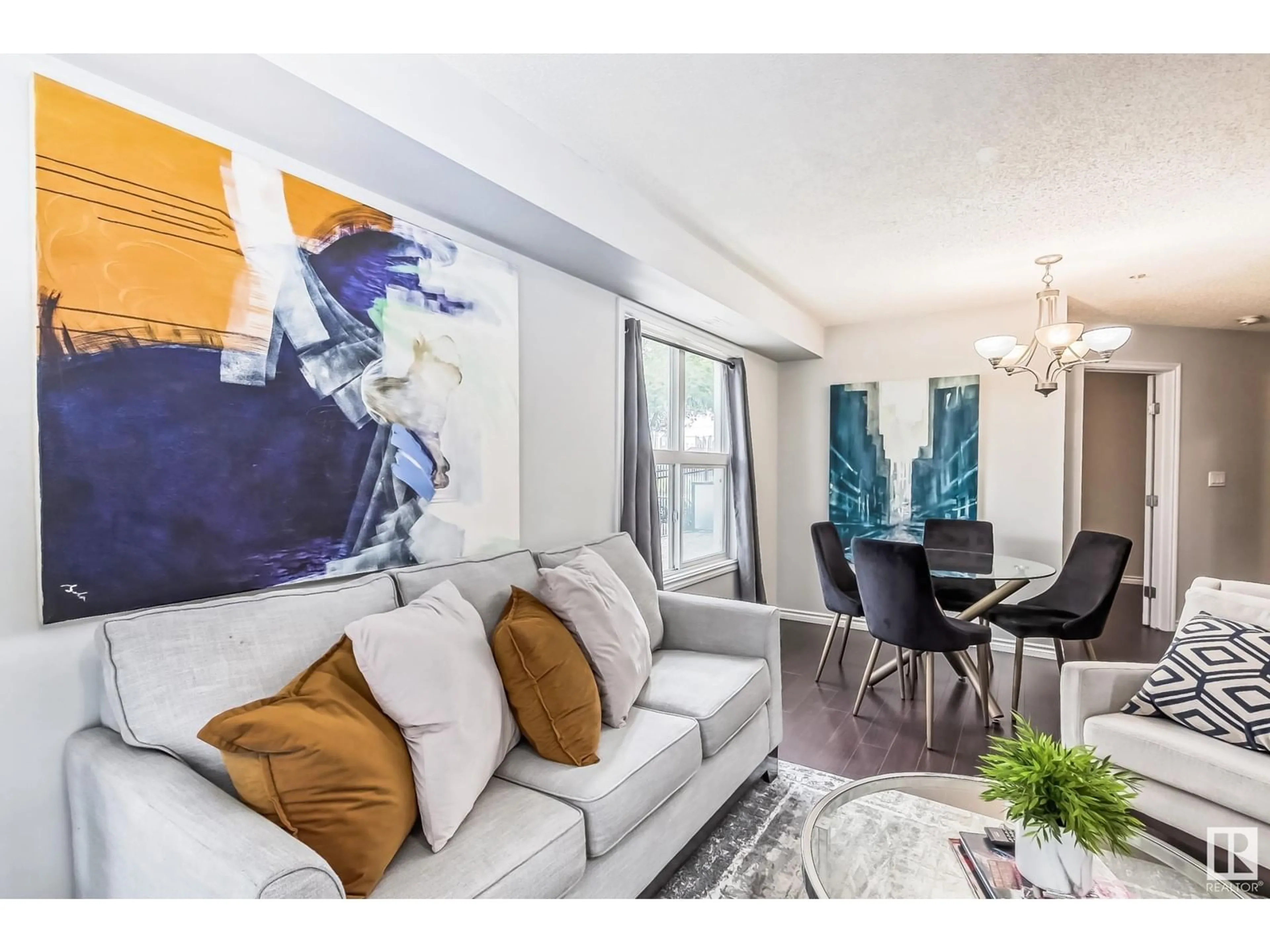 Living room with furniture, unknown for 115 10118 106 AVE NW, Edmonton Alberta T5H0B8