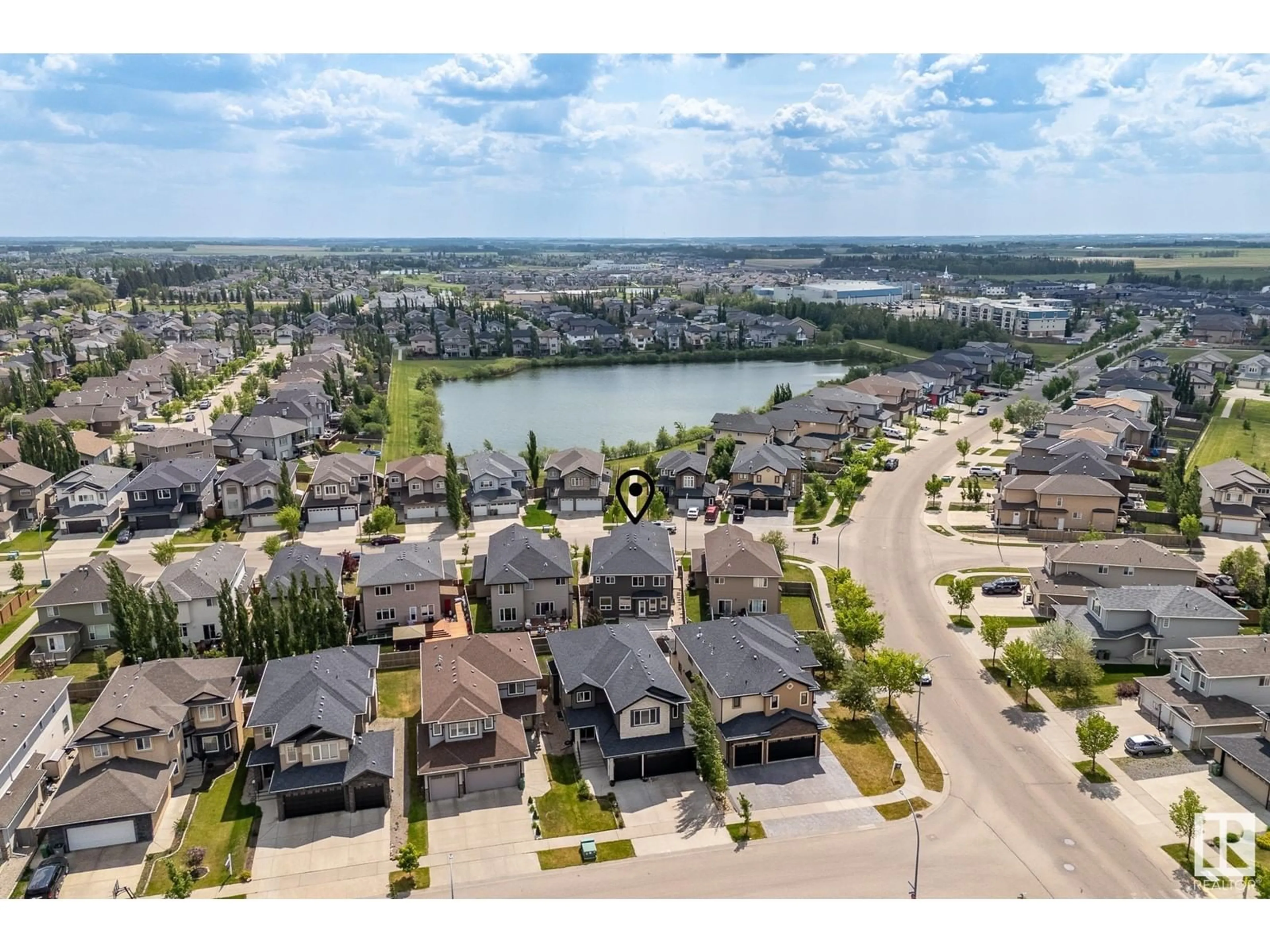 A pic from outside/outdoor area/front of a property/back of a property/a pic from drone, water/lake/river/ocean view for 6112 55 AV, Beaumont Alberta T4X0H3