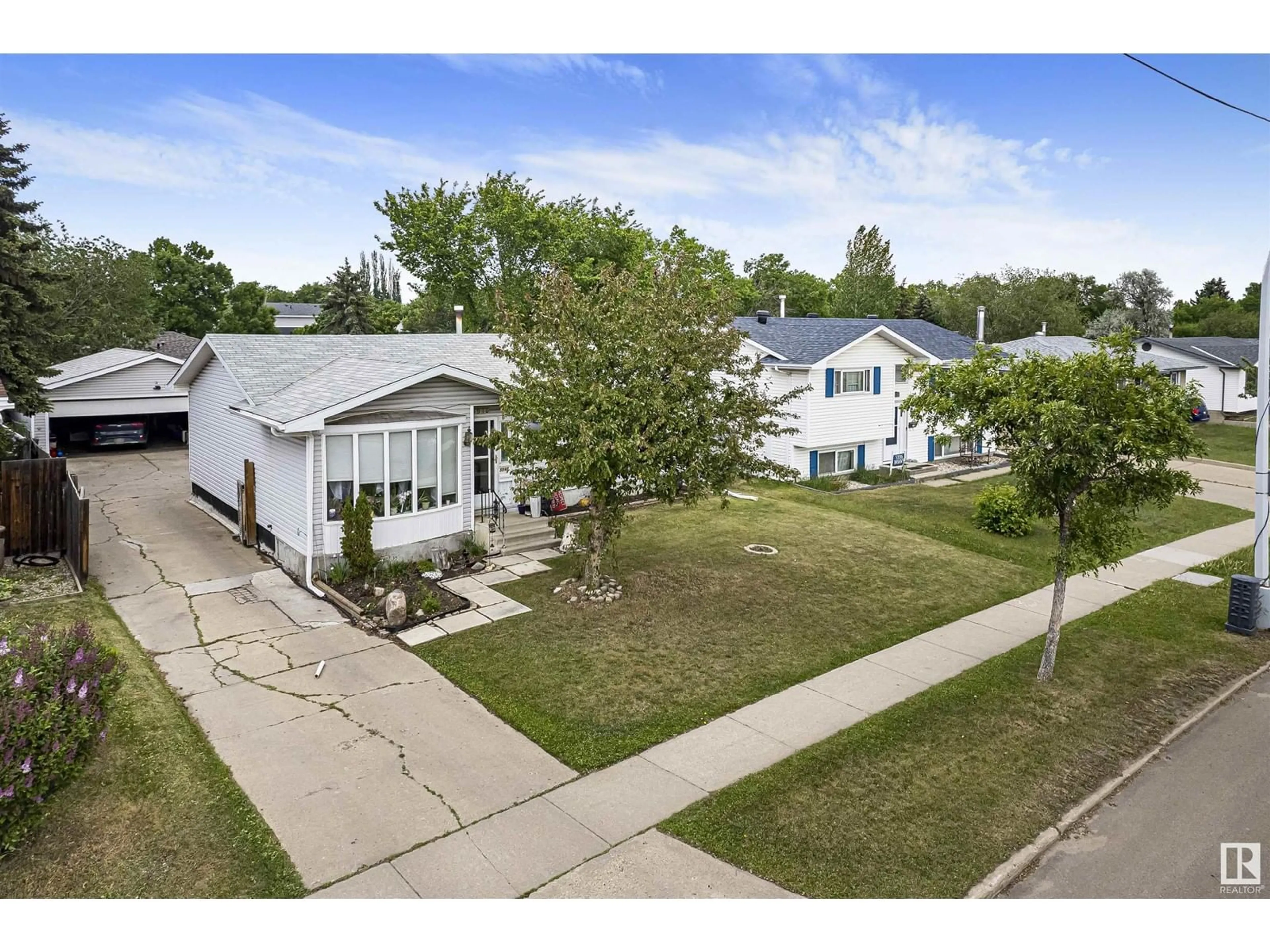 A pic from outside/outdoor area/front of a property/back of a property/a pic from drone, street for 5940 149 AV, Edmonton Alberta T5A1V6