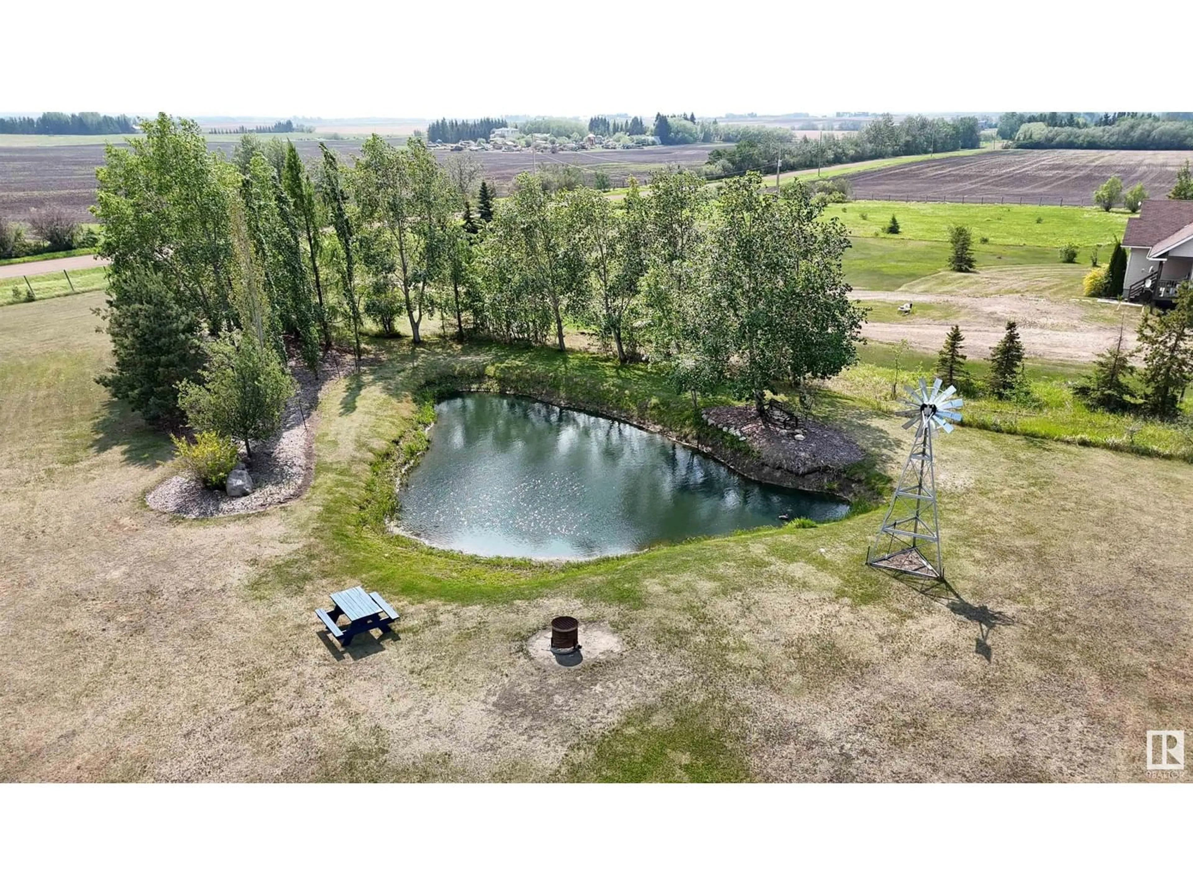 A pic from outside/outdoor area/front of a property/back of a property/a pic from drone, water/lake/river/ocean view for 23222 TWP RD 560, Gibbons Alberta T0A1N0