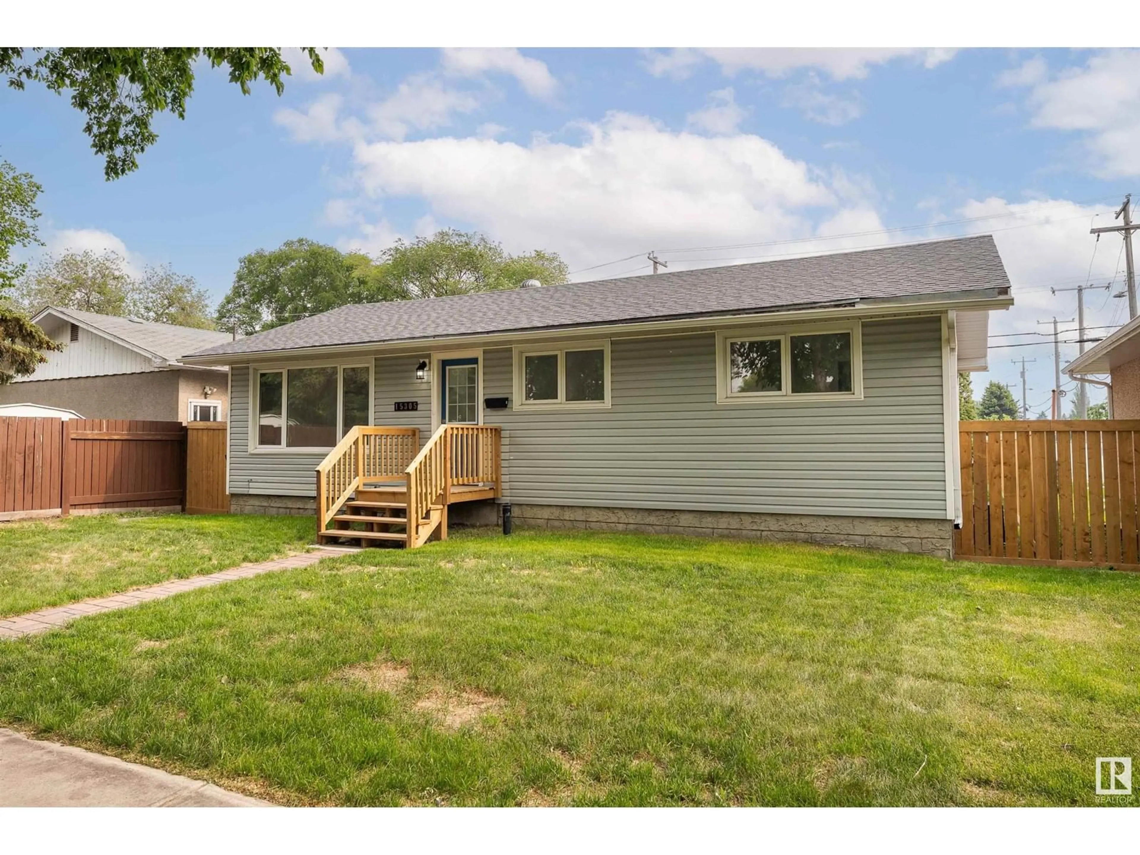 Home with vinyl exterior material, street for 15305 110A AV, Edmonton Alberta T5P1H4